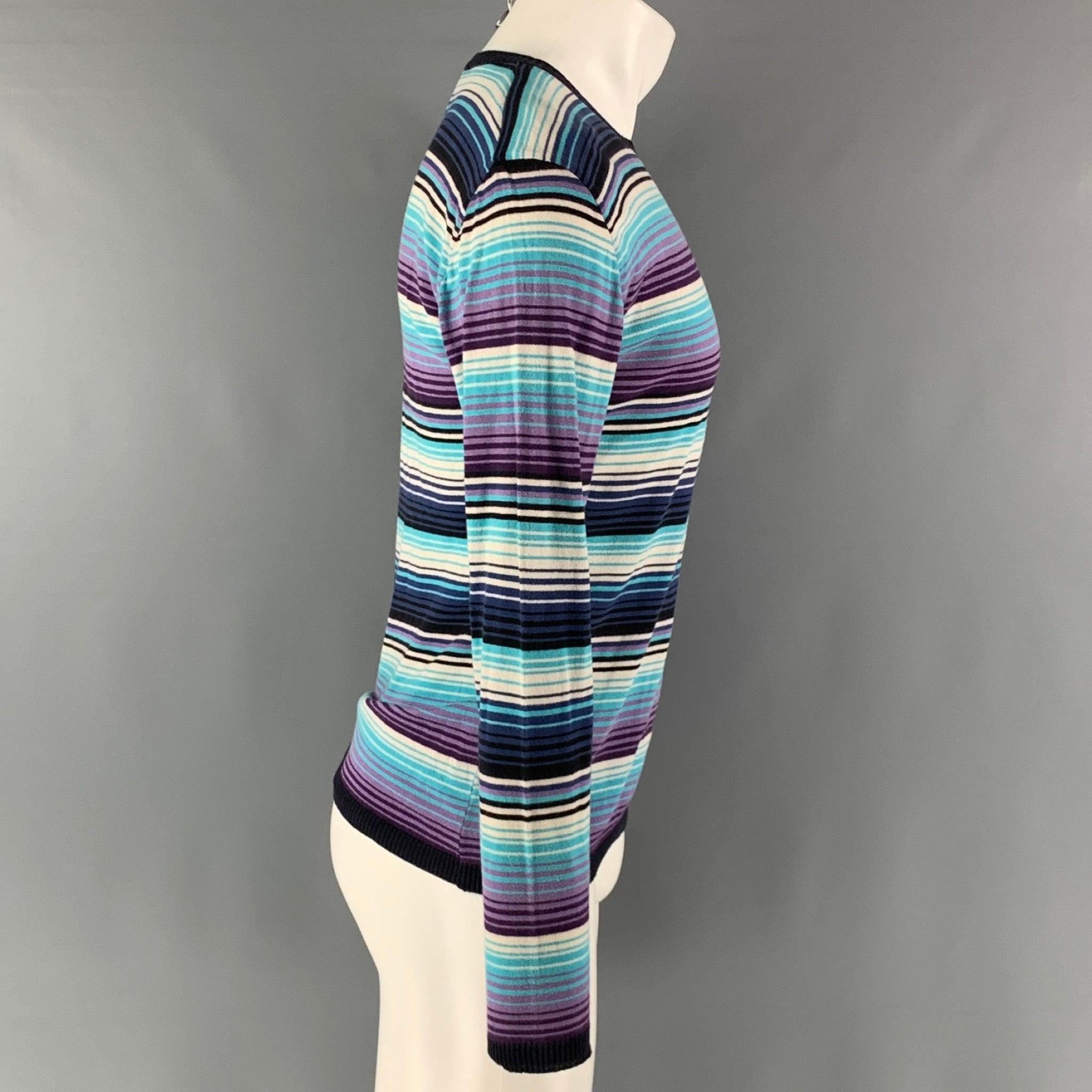 ETRO pullover comes in a blue and purple striped jersey knit material featuring a crew-neck. Made in Italy.Good Pre-Owned Condition. Moderate signs of wear. Fabric Tag Removed. 

Marked:   L 

Measurements: 
 
Shoulder: 21 inches 
 Chest: 41 inches 