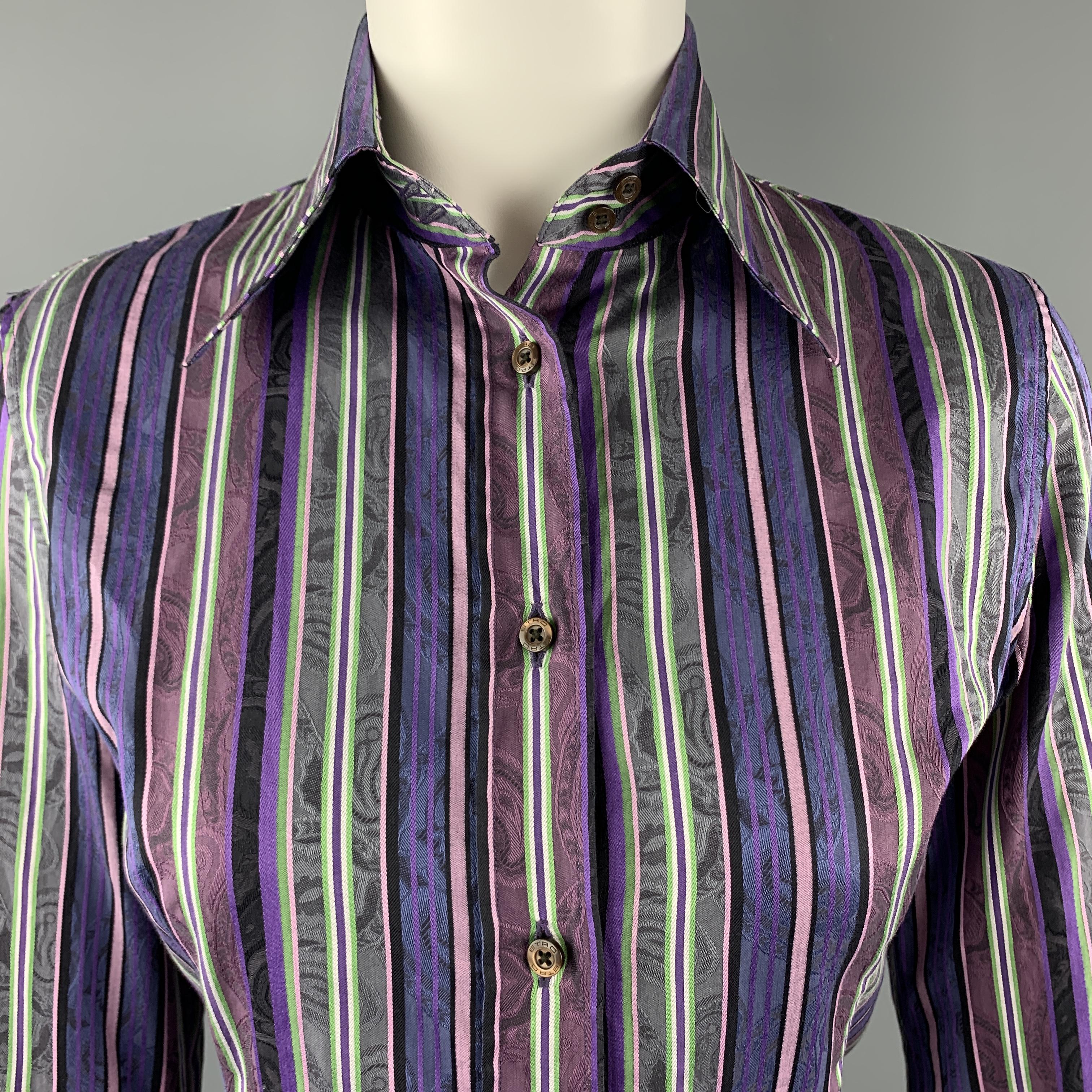 ETRO blouse comes in purple and green printed striped cotton with a pointed collar and button up front. Made in Italy.

Excellent Pre-Owned Condition.
Marked: IT 40

Measurements:

Shoulder: 15 in.
Bust: 38 in.
Sleeve: 23 in.
Length: 24 in.