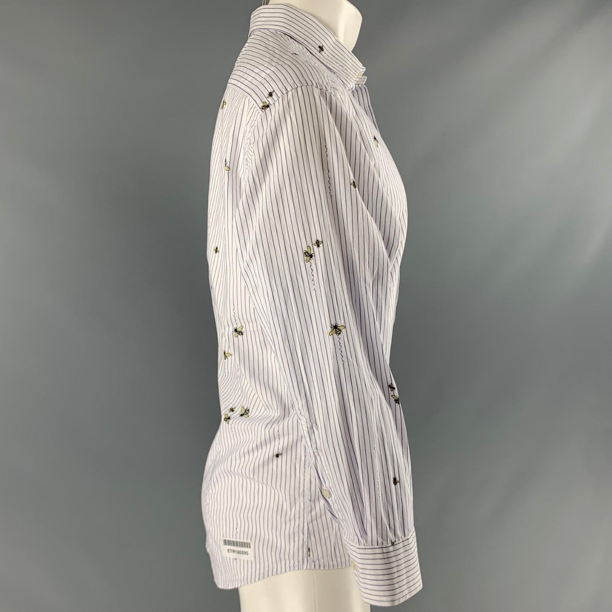 ETRO long sleeve shirt
in a white cotton fabric featuring thin vertical purple stripes and insect print, spread collar, and button closure. Made in Italy.Excellent Pre-Owned Condition. 

Marked:   43 

Measurements: 
 
Shoulder: 18 inches Chest: 47