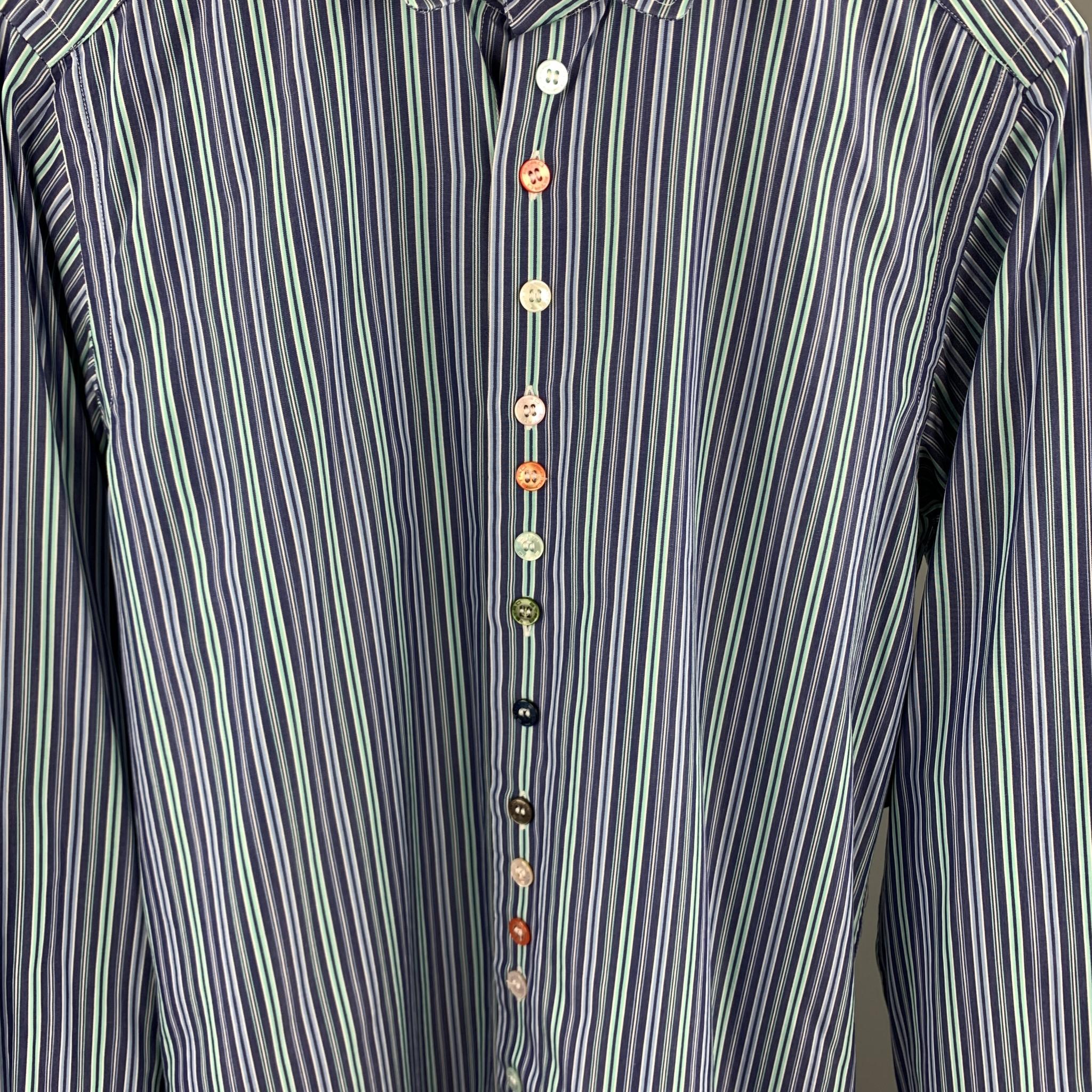 ETRO long sleeve shirt comes in a blue & green stripe cotton featuring a button up style, multi-color buttons, and a spread collar. Made in Italy.

Excellent Pre-Owned Condition.
Marked: 38

Measurements:

Shoulder: 15 in. 
Chest: 38 in. 
Sleeve: