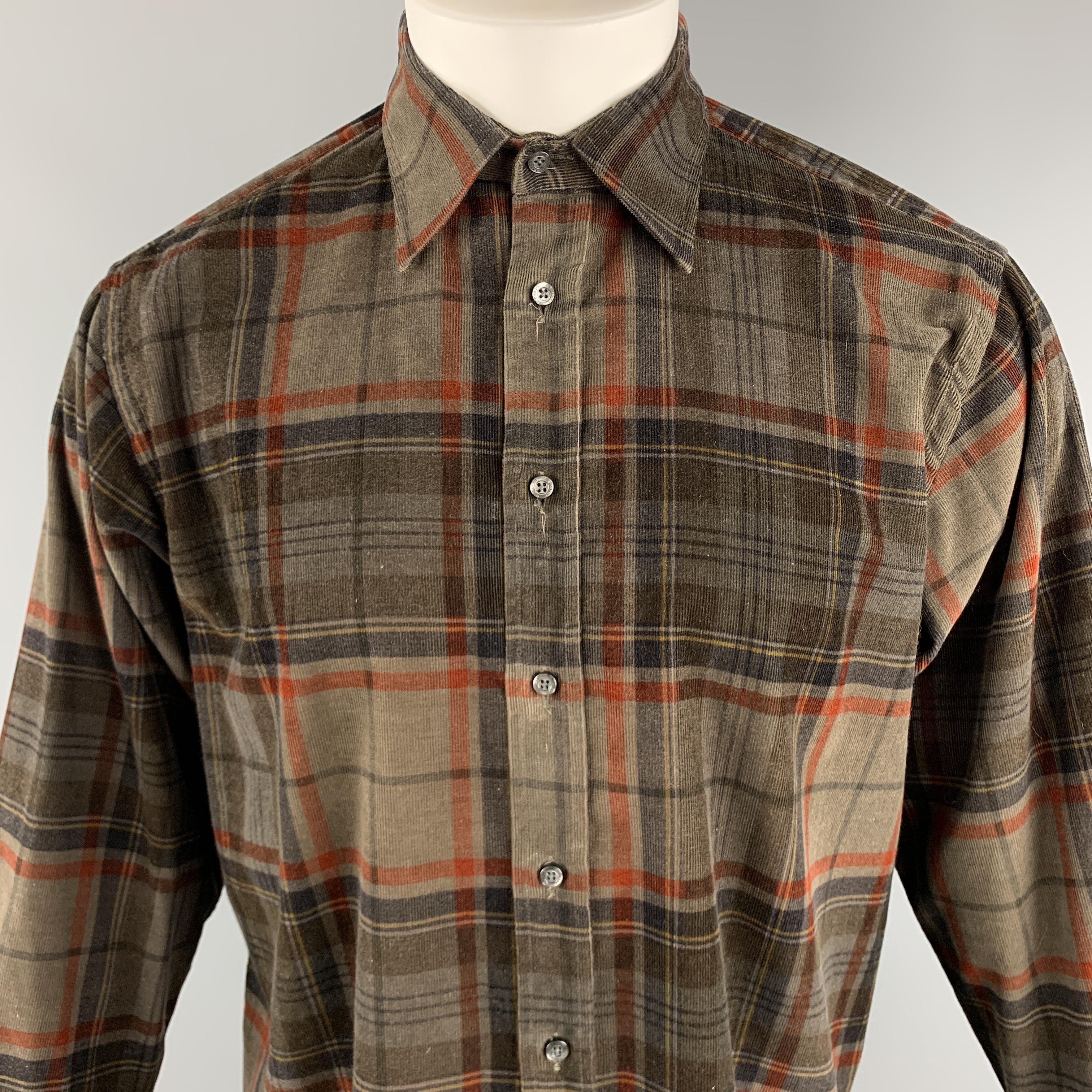 ETRO Long Sleeve Shirt comes in brown and orange tones in a plaid corduroy material, with a classic collar and buttoned cuffs, button up. Made in Italy.

Very Good Pre-Owned Condition.
Marked: 39

Measurements:

Shoulder: 18.5 in. 
Chest: 47 in.