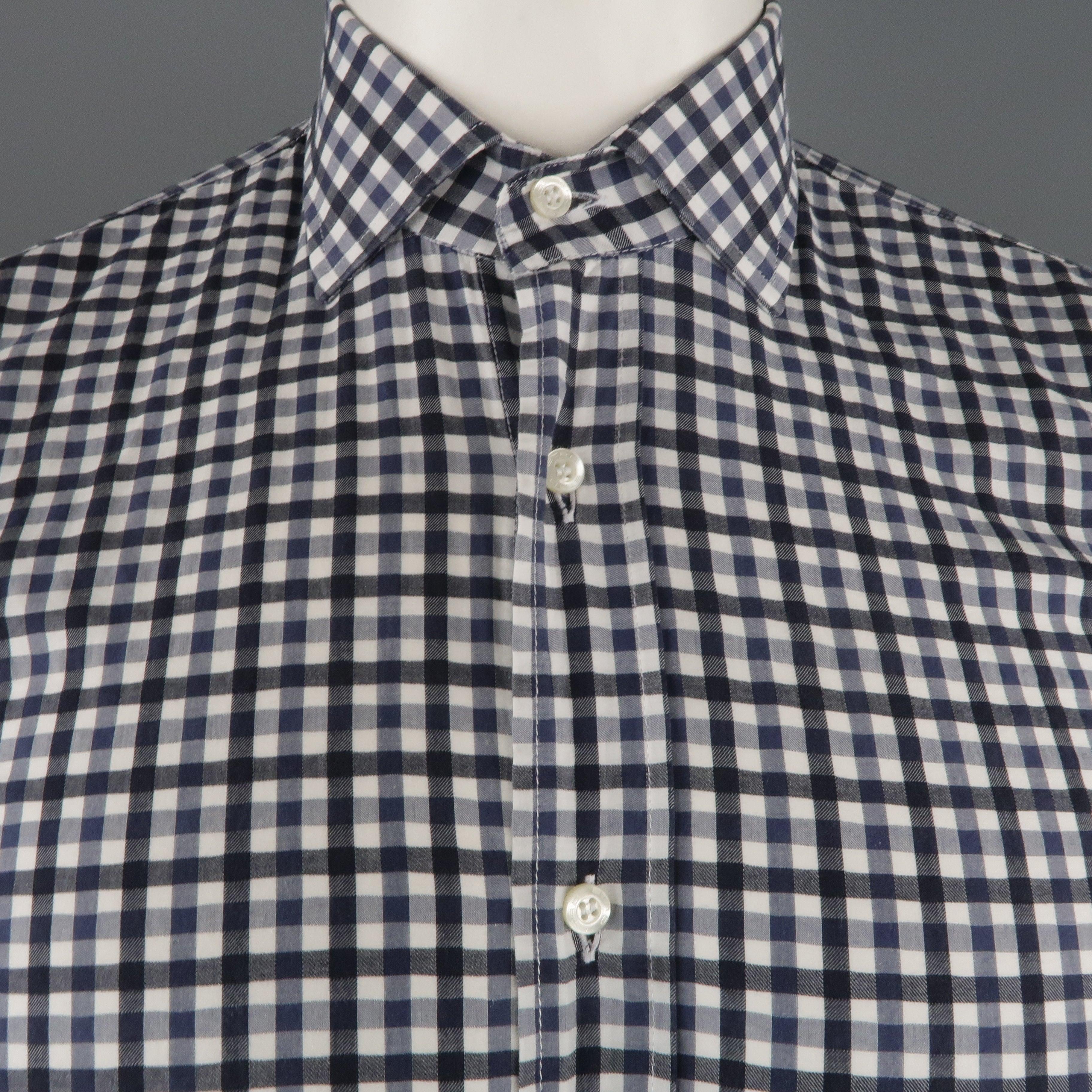 ETRO shirt comes in a black and white checkered cotton featuring a spread collar. Made in Italy.Excellent Pre-Owned Condition. 

Marked:   39 

Measurements: 
 
Shoulder: 17.5 inches  Chest: 42 inches  Sleeve: 24.5 inches Length: 25.5 inches  
 
  
