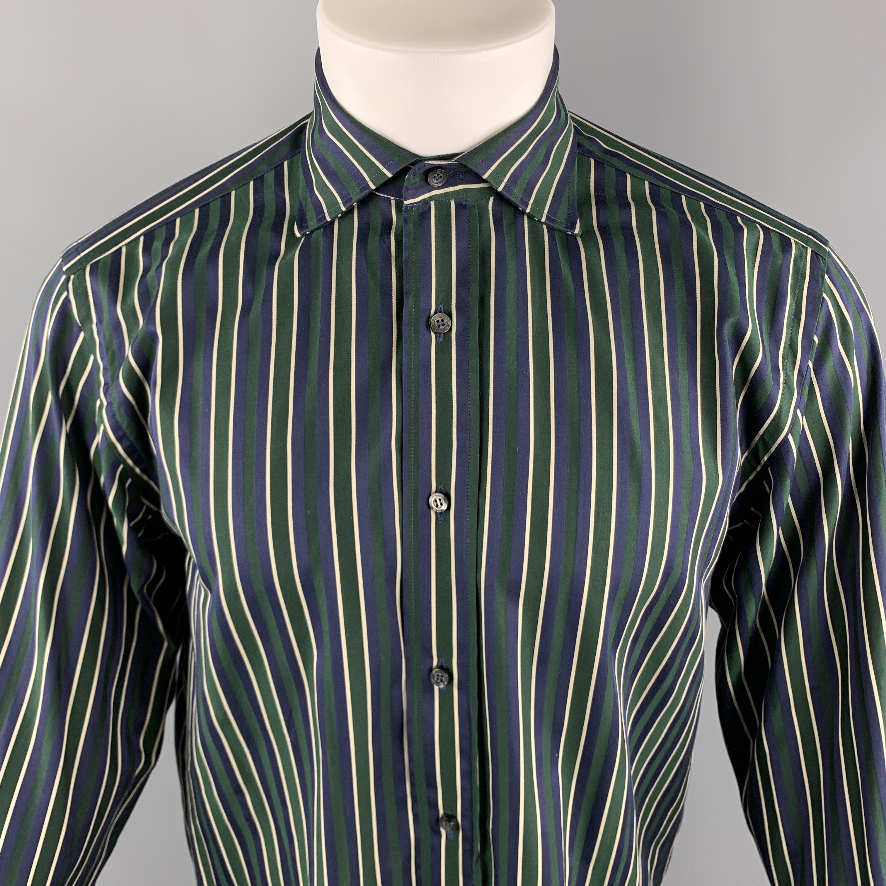 ETRO Long Sleeve Shirt comes in navy and green tones in a striped cotton material, with a spread collar and buttoned cuffs, button up. Made in Italy.

Very Good Pre-Owned Condition.
Marked: 39

Measurements:

Shoulder: 18 in. 
Chest: 42 in. 
Sleeve: