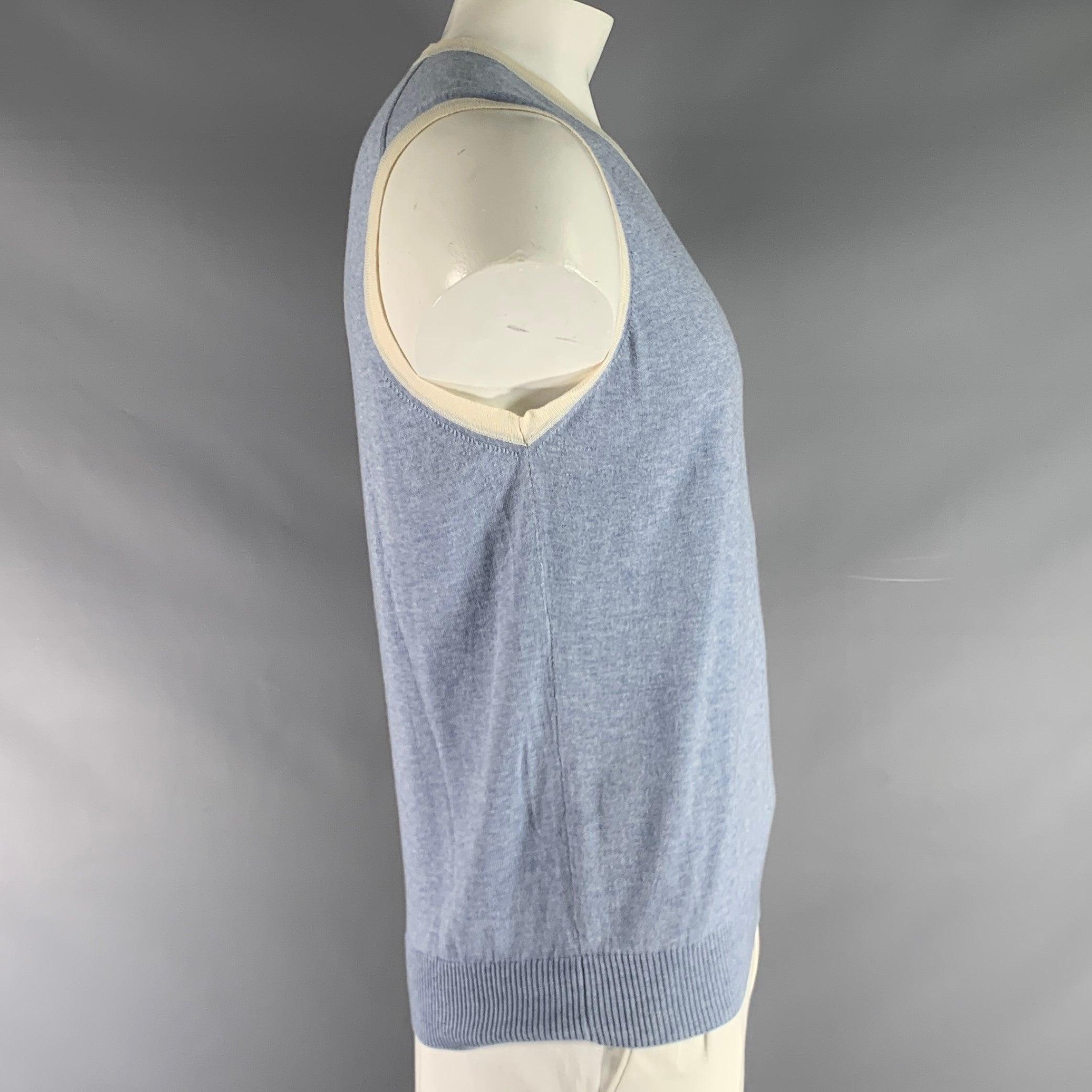 ETRO sweater vest comes in blue and white cashmere knit with a v neck. Made in Italy.Very Good Pre-Owned Condition. 

Marked:   XL 

Measurements: 
 
Shoulder: 16 inches Chest: 47 inches Length: 27 inches 
 
  
  
 
Sui Generis Reference: