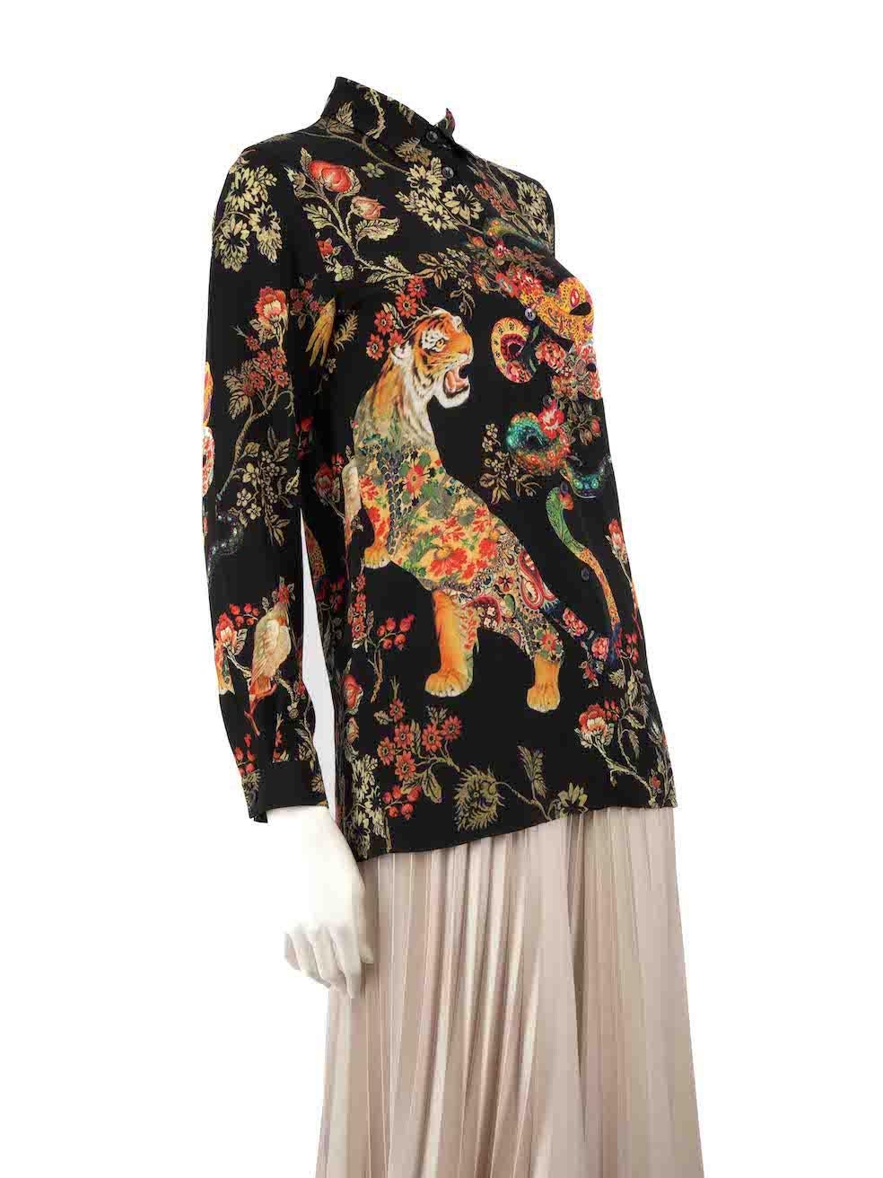 CONDITION is Very good. Hardly any visible wear to blouse is evident on this used Etro designer resale item.
 
Details
Multicolour - black, brown and red
Silk
Blouse
Tiger and floral print
Long sleeves
Round neck
Button up fastening
Buttoned
