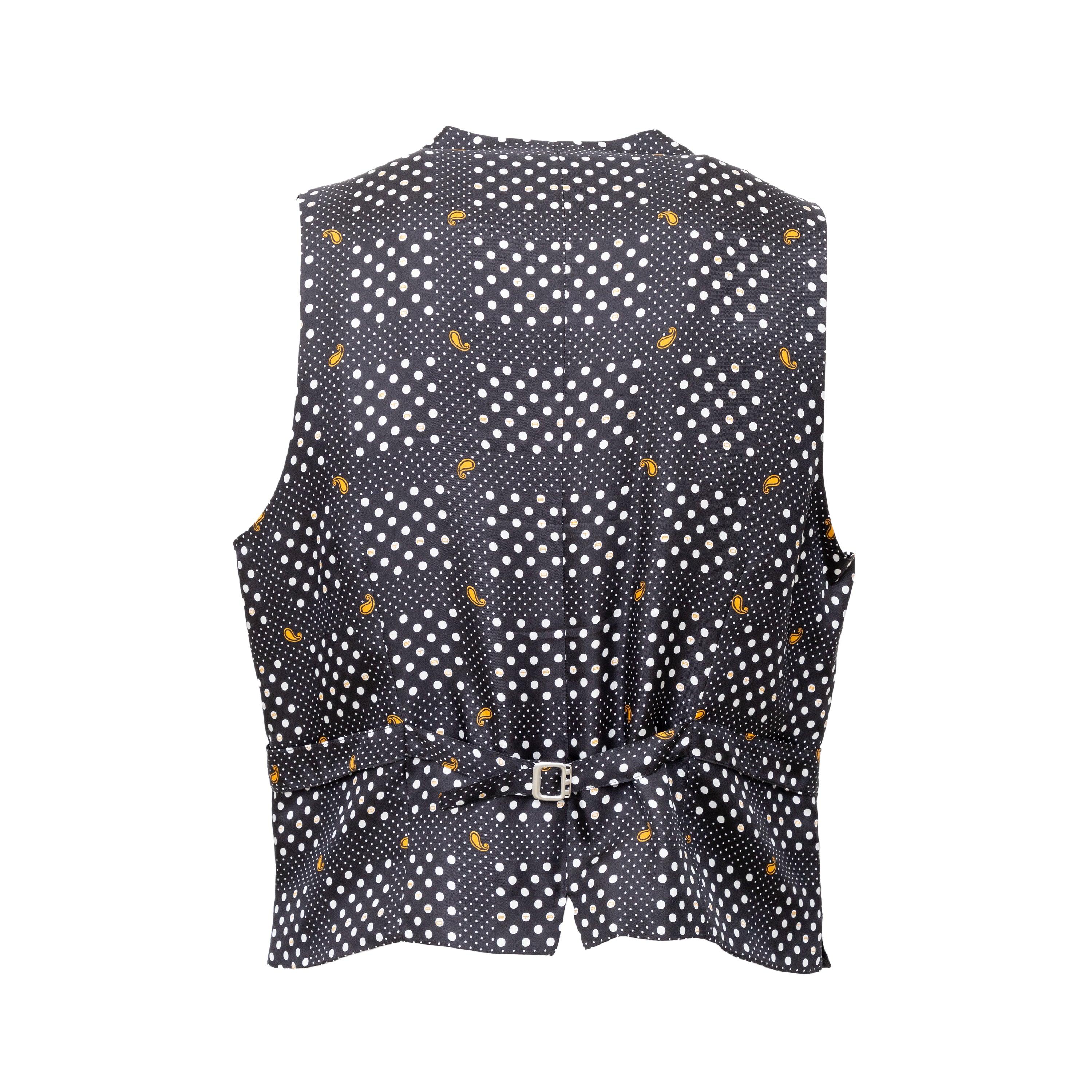 Crafted from a luxurious cotton blend velvet, this Etro vest boasts a sophisticated black hue and a notched lapel collar with front buttons. The silk lining features the brand's iconic emblem on the back, while the small buckle on the back waist