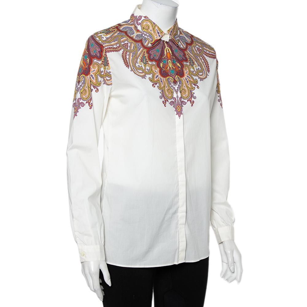 Effortlessly stylish and feminine, this Etro shirt is great for casual days. Tailored from a cotton blend, it carries a white hue and flaunts a signature plaisley print. It has a smart silhouette, long sleeves, a collar, and a buttoned front. It