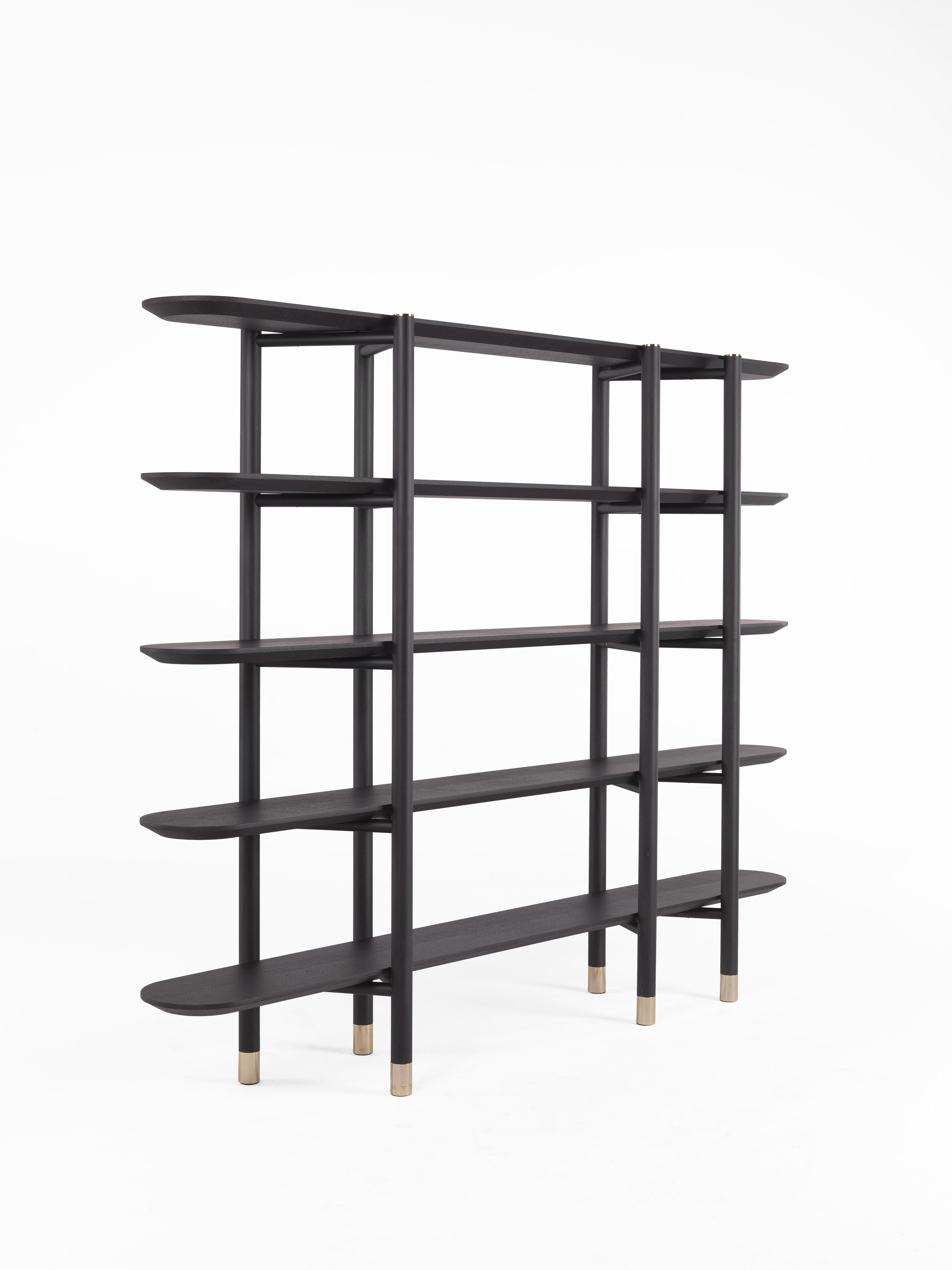 A bookcase with an original design and simple lines to complete Woodstock collection launched in 2018. The dark hues and the Carbalho essence recall the afro mood of the 2019 collection.

WOODSTOCK Bookcase with Structure in matte dark wengé dyed