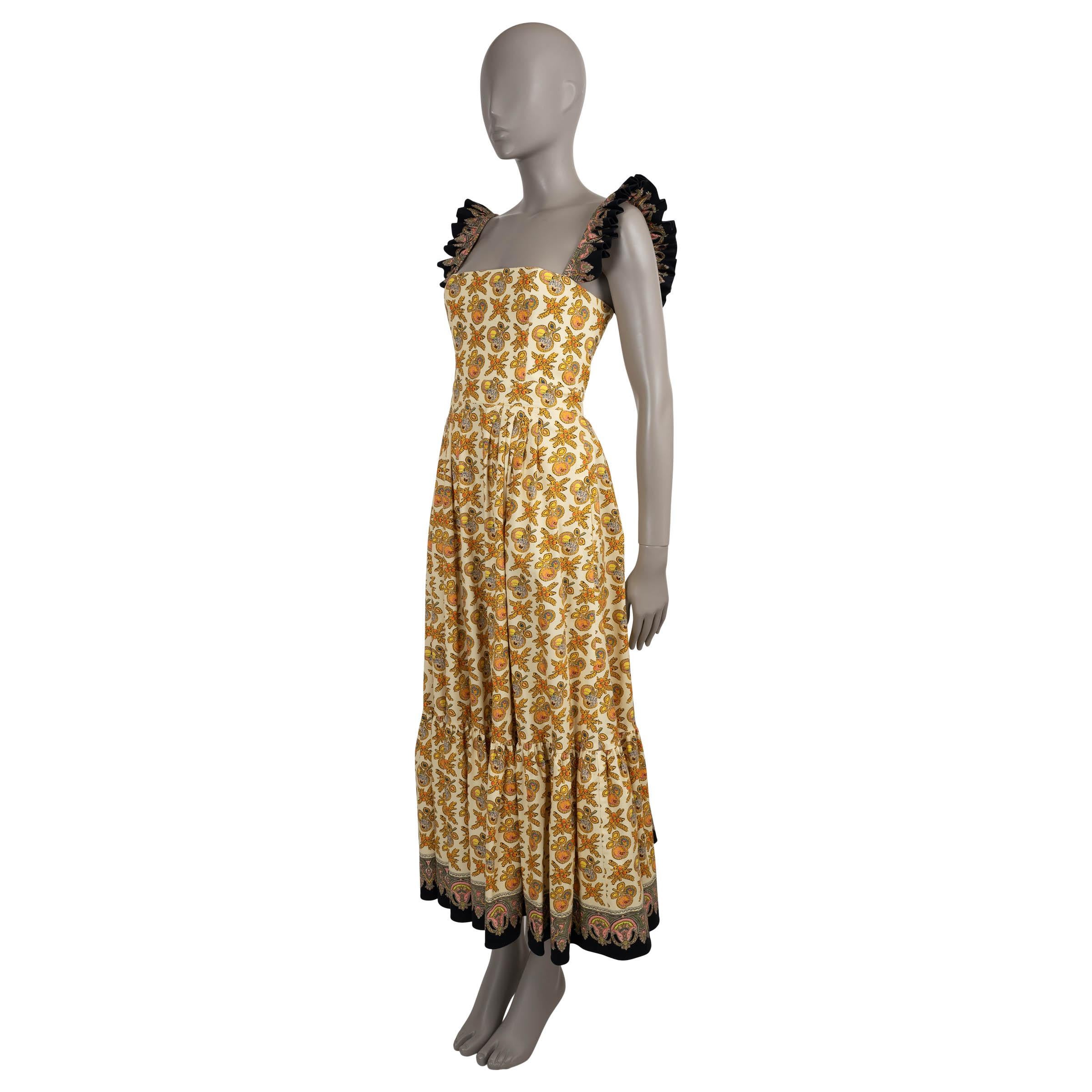 This 100% authentic Etro dress is crafted in white poplin cotton with 3% elastane, featuring an intricate apple motif in yellow and multicolored tones. The fit-and-flare silhouette is accented by a square neckline, ruffled shoulder straps in