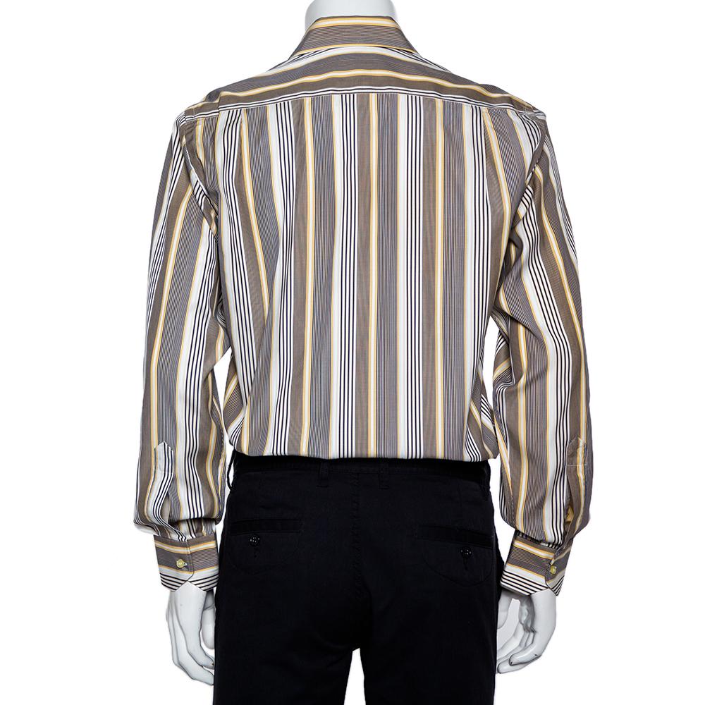 For days of style at work, Etro brings you this pretty creation. The shirt, styled with a striped pattern in yellow and navy blue hues, is both comfortable and stylish. It is designed with a collared neckline, cuffed sleeves, and lined with front