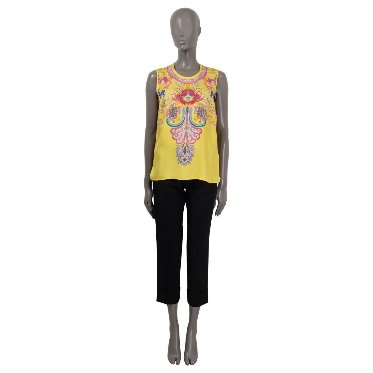 100% authentic Etro sleeveless native print blouse in yellow, blue, red, pink, lilac, white and grey silk (100%) with a buttoned back. Has been worn and is in excellent condition. 

Measurements
Tag Size	42
Size	M
Shoulder Width	35cm (13.7in)
Bust