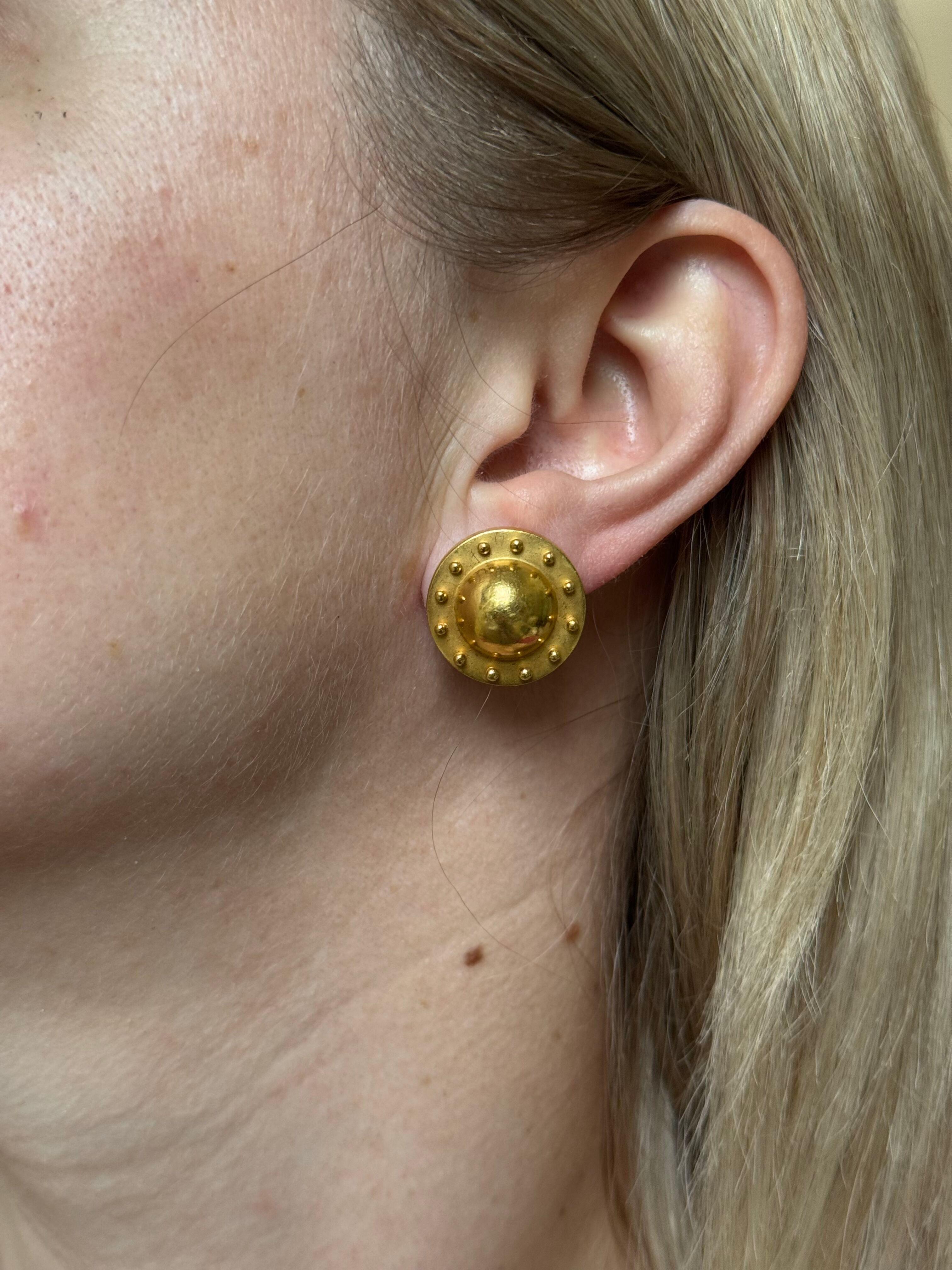 Pair of 22k yellow gold button earrings, featuring Etruscan beading design on the rim. Earrings measure 0.75