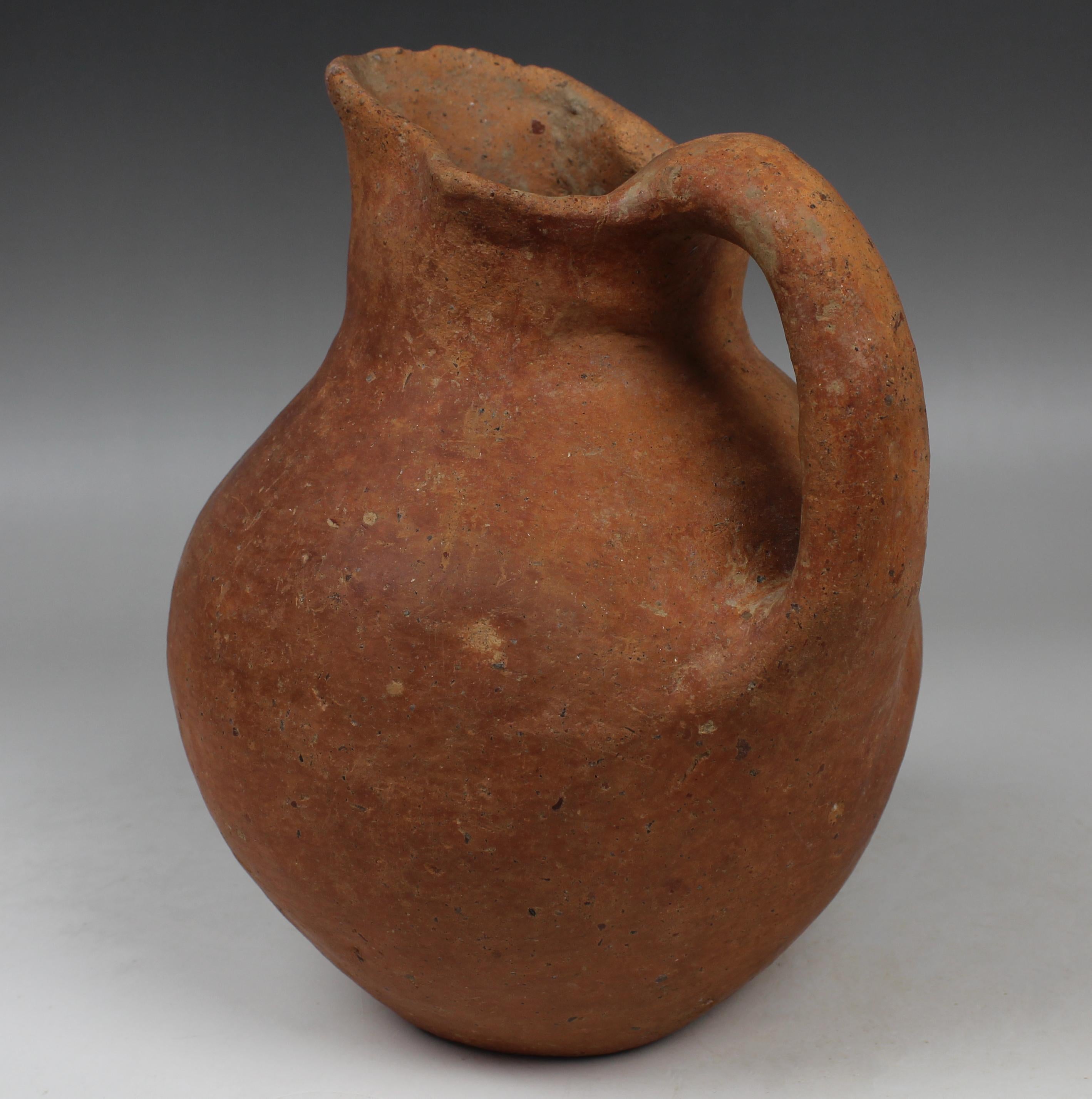 ITEM: Beaked jug
MATERIAL: Pottery
CULTURE: Etruscan
PERIOD: 7th Century B.C
DIMENSIONS: 185 mm x 140 mm
CONDITION: Good condition
PROVENANCE: Ex German private collection, K.F., from and old family estate, acquired before 1980s

Comes with
