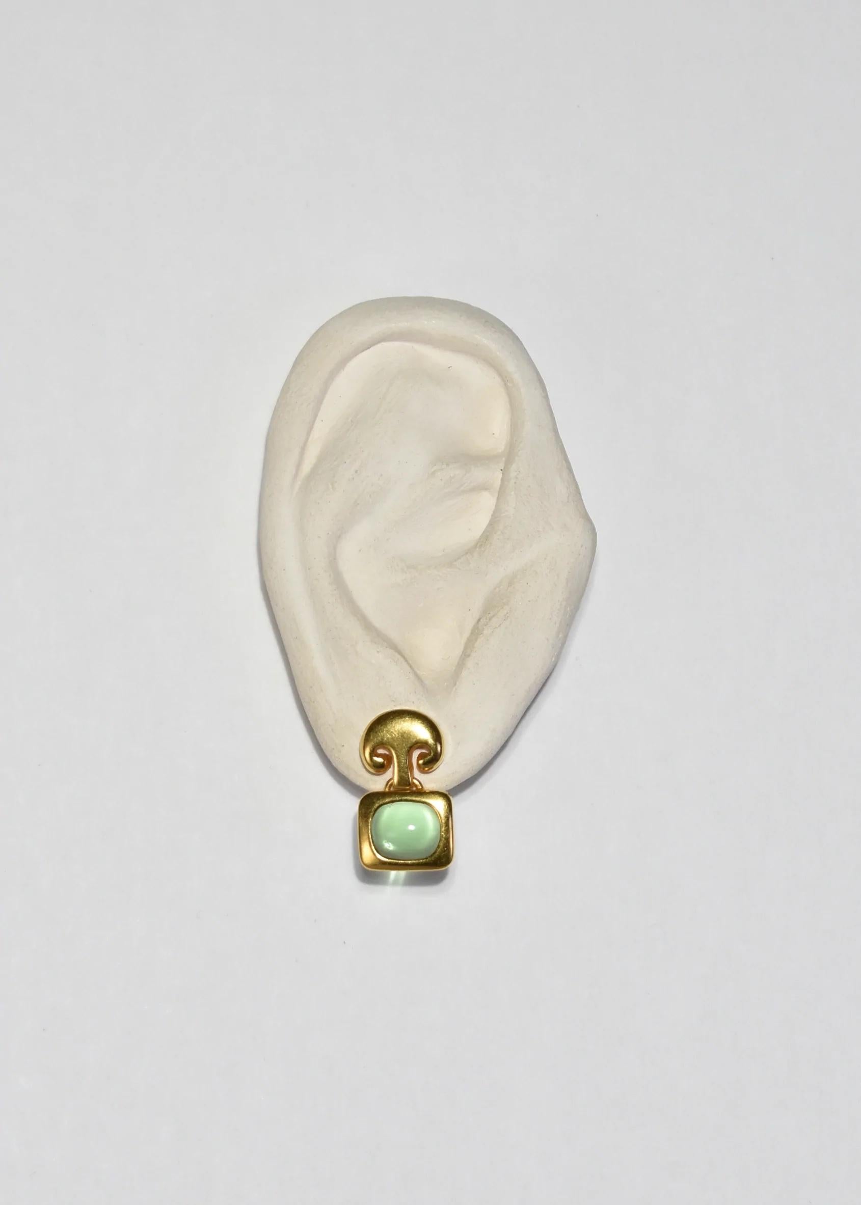 Gold Etruscan style earrings with light green glass cabochons. Stamped ﻿MMA.

﻿Material: Metal, glass.