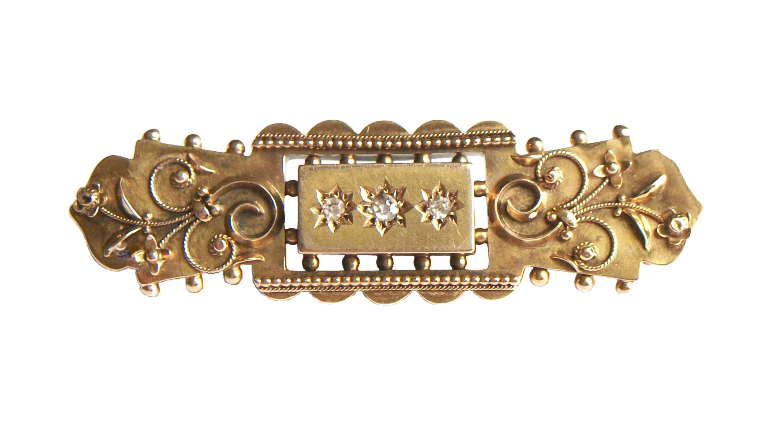 Victorian Etruscan Revival 15K yellow gold bar brooch/pin - set with three old mine cut diamonds (center one - 2 mm. diameter  flanked by one on each side - 1.5 mm. diameter each) - hand made with fine detail including twisted gold rope and flowers
