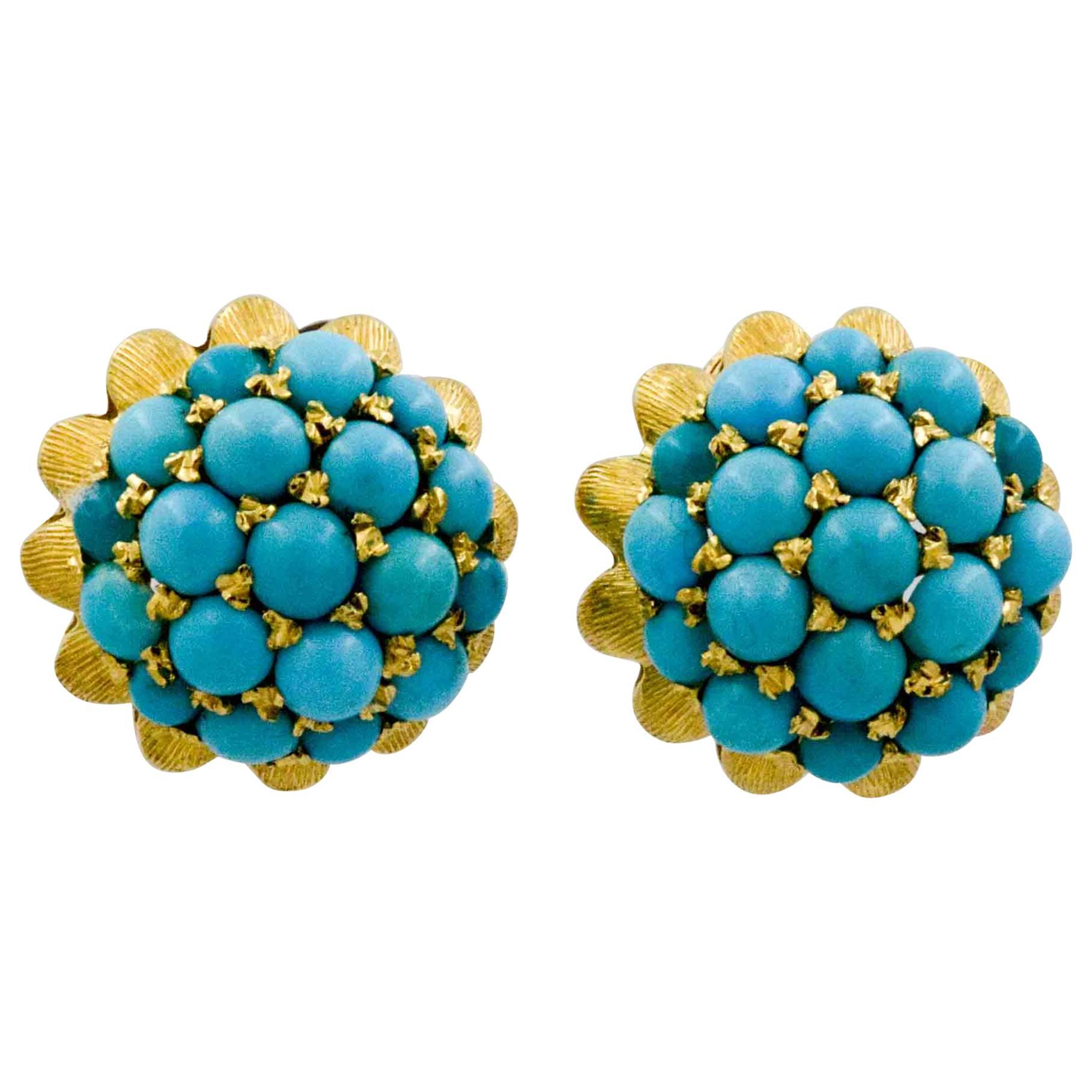 If you love turquoise; you will love these Etruscan Revival style cabochon cut turquoise stud earrings. Shimmering 18 karat gold highlights peek through 32 round cabochon cut turquoise. These beautiful earrings are domed and have post back studs.