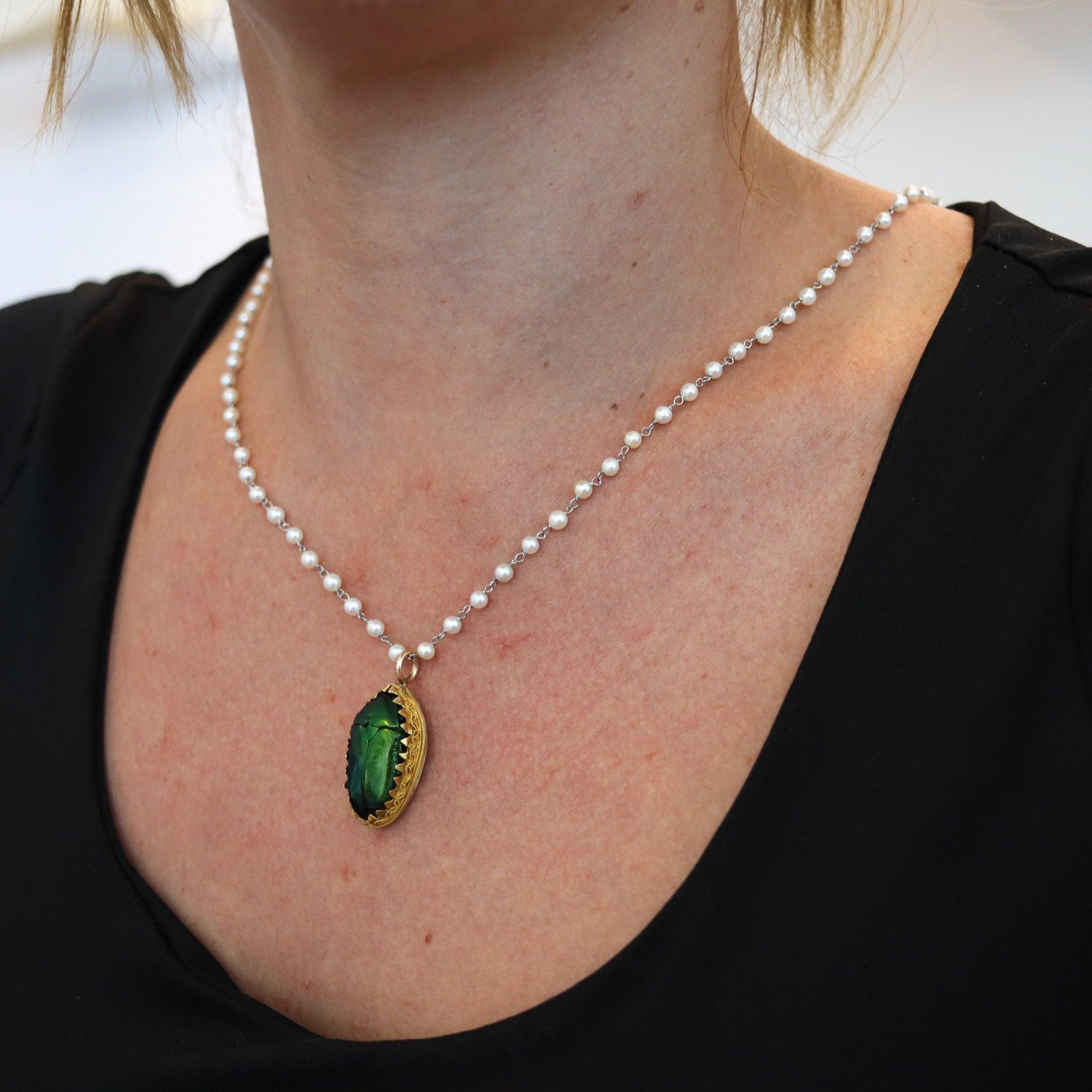 Egyptian-Etruscan revival scarab beetles pendant.

This is a very beautiful and unusual pendant, created in England during the Victorian period, back in the 1870. The pendant was carefully crafted in the desirable Egyptian-Etruscan revival style in