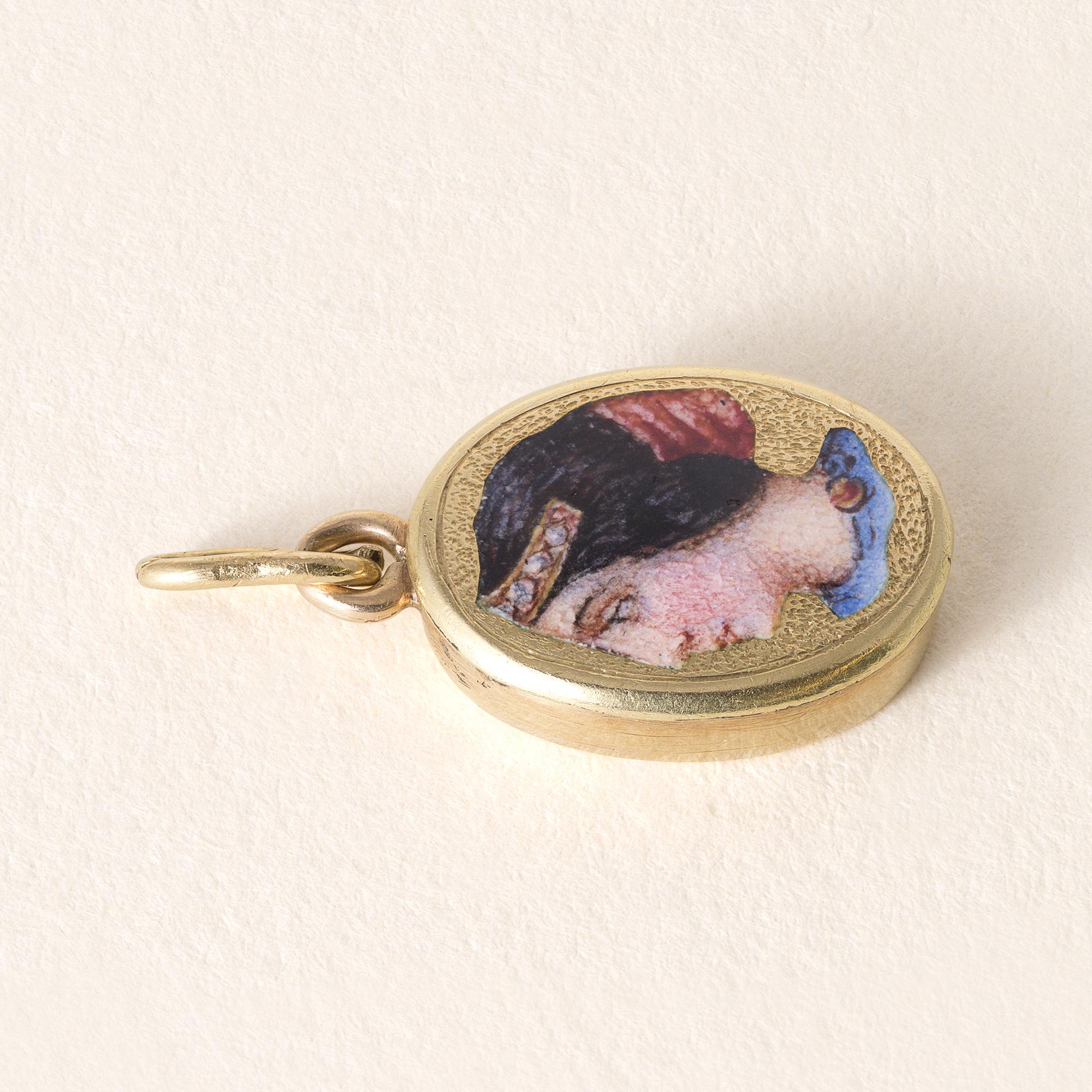This is an antique Etruscan revival pendant
featuring a portrait of an ancient Etruscan woman in a red headdress.
Intricate miniature hand painting and gold detailing
2.4 grams
0.9 inch with bale x 0.50 inch width