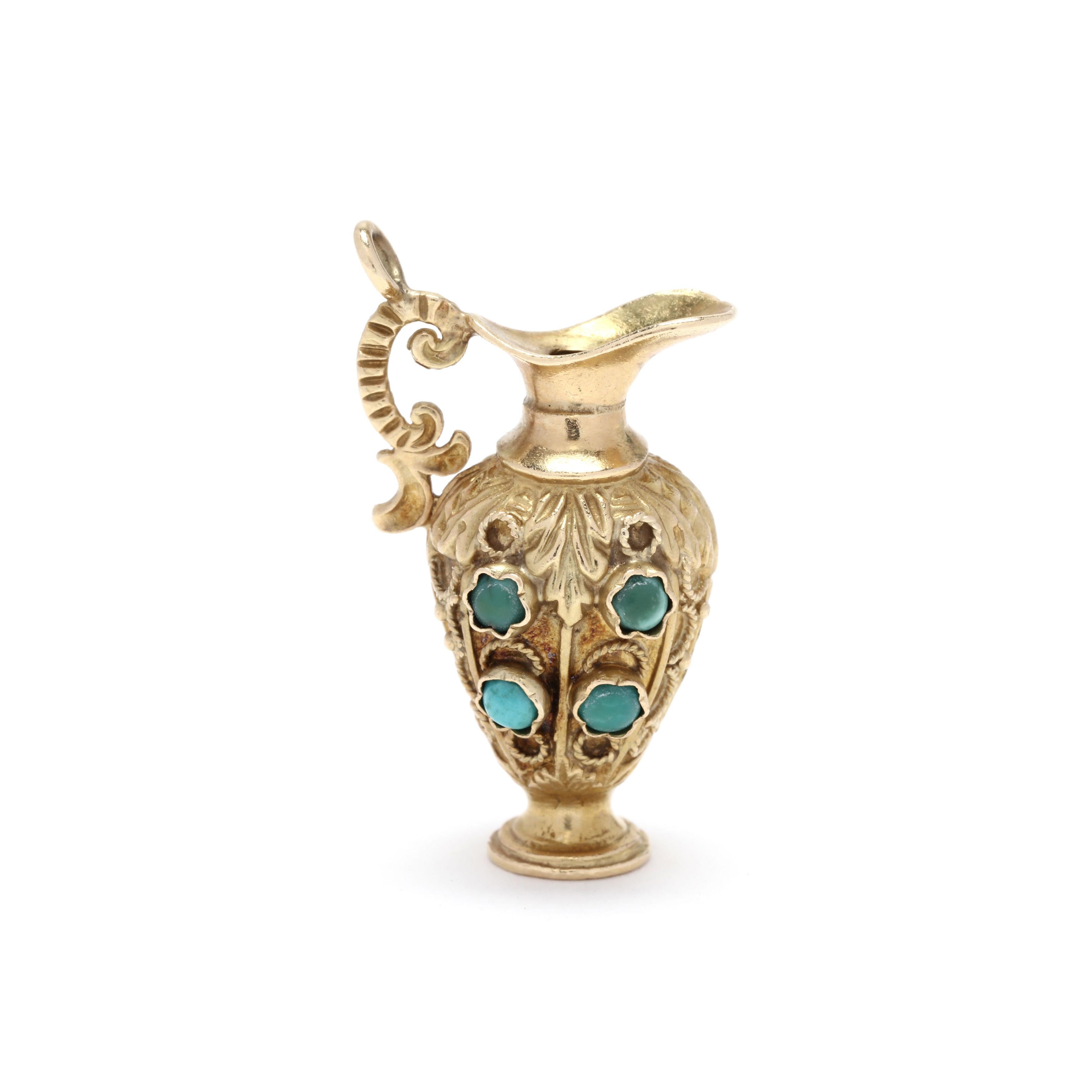 An etruscan revival 18 karat yellow gold and turquoise vase charm / pendant. This charm features a poured vase motif with eight round cabochon turquoise stone and applied gold accents.



Length: 1 1/8 in.



Width: 3/4 in.



Weight: 6.52 dwts.