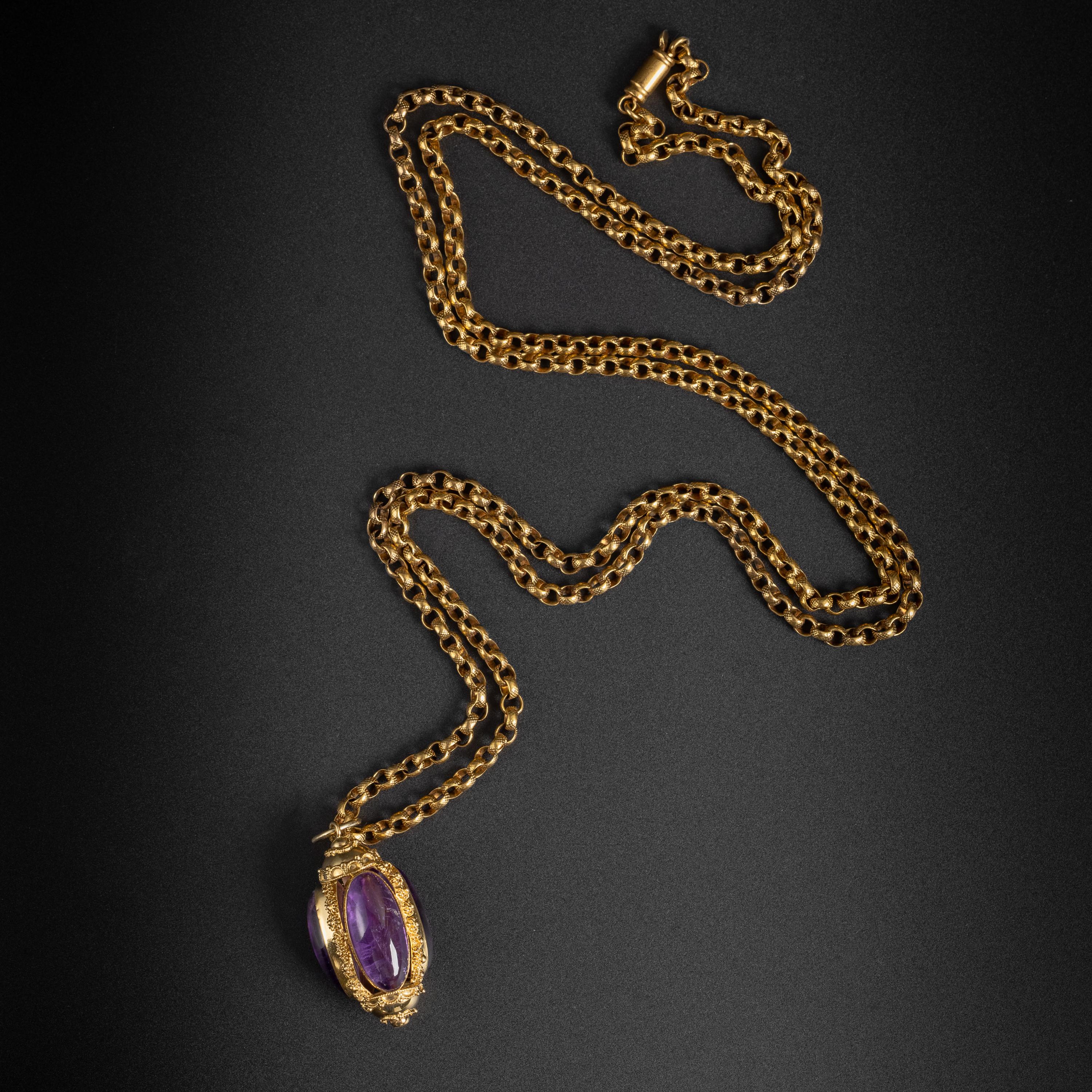 This is a finely crafted Etruscan revival amethyst and gold three-sided pendant. Each oblong cabochon measures approximately 22mm x 10mm x 5mm and each weighs approximately 9 carats. These 30 carats of amethyst are a fine, rich purple with high