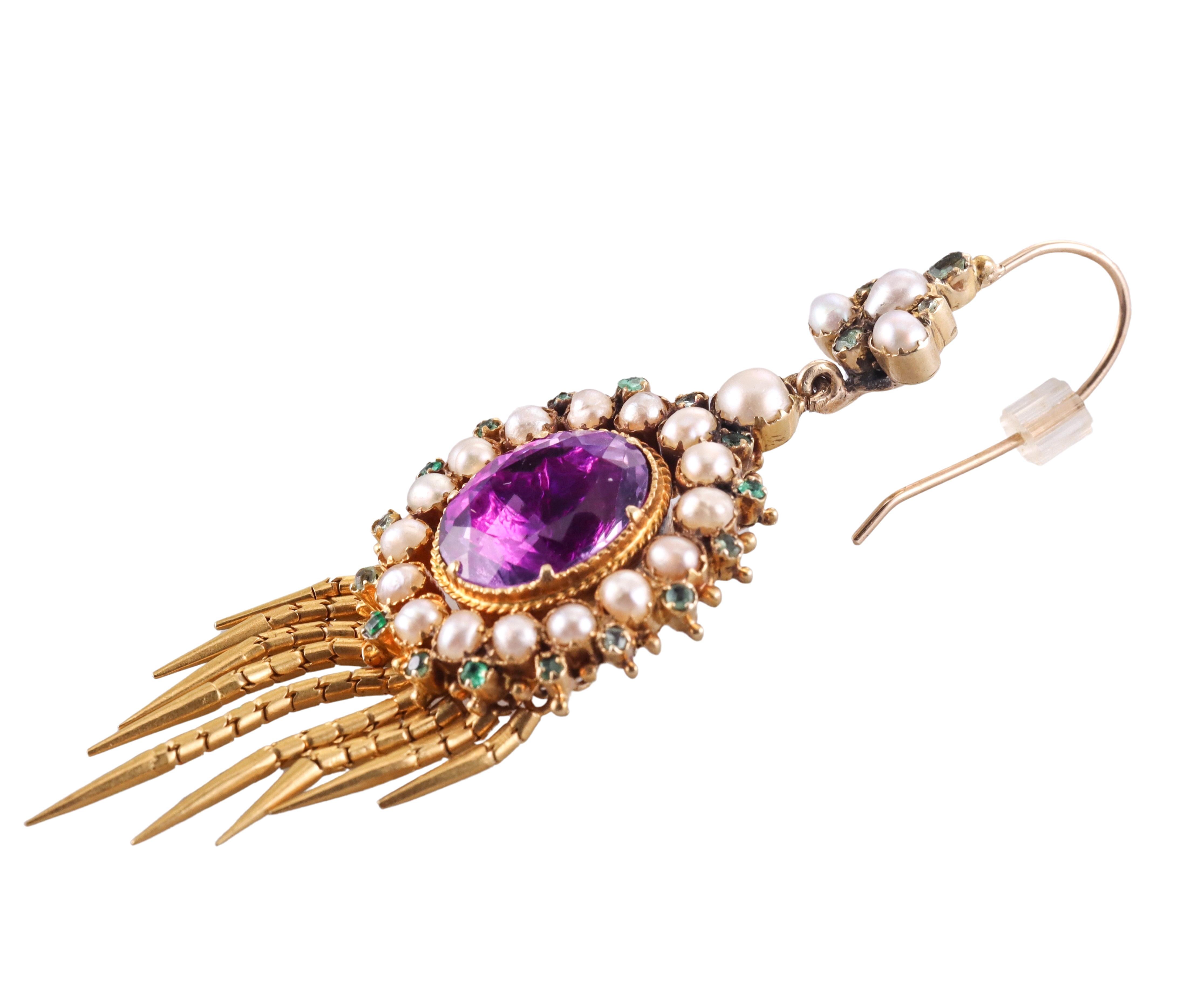 Pair of antique Etruscan Revival earrings, set in 18k gold, featuring movable fringe drops. The earrings are decorated with center oval amethysts, surrounded with pearls and small emeralds.  Measure 2.5