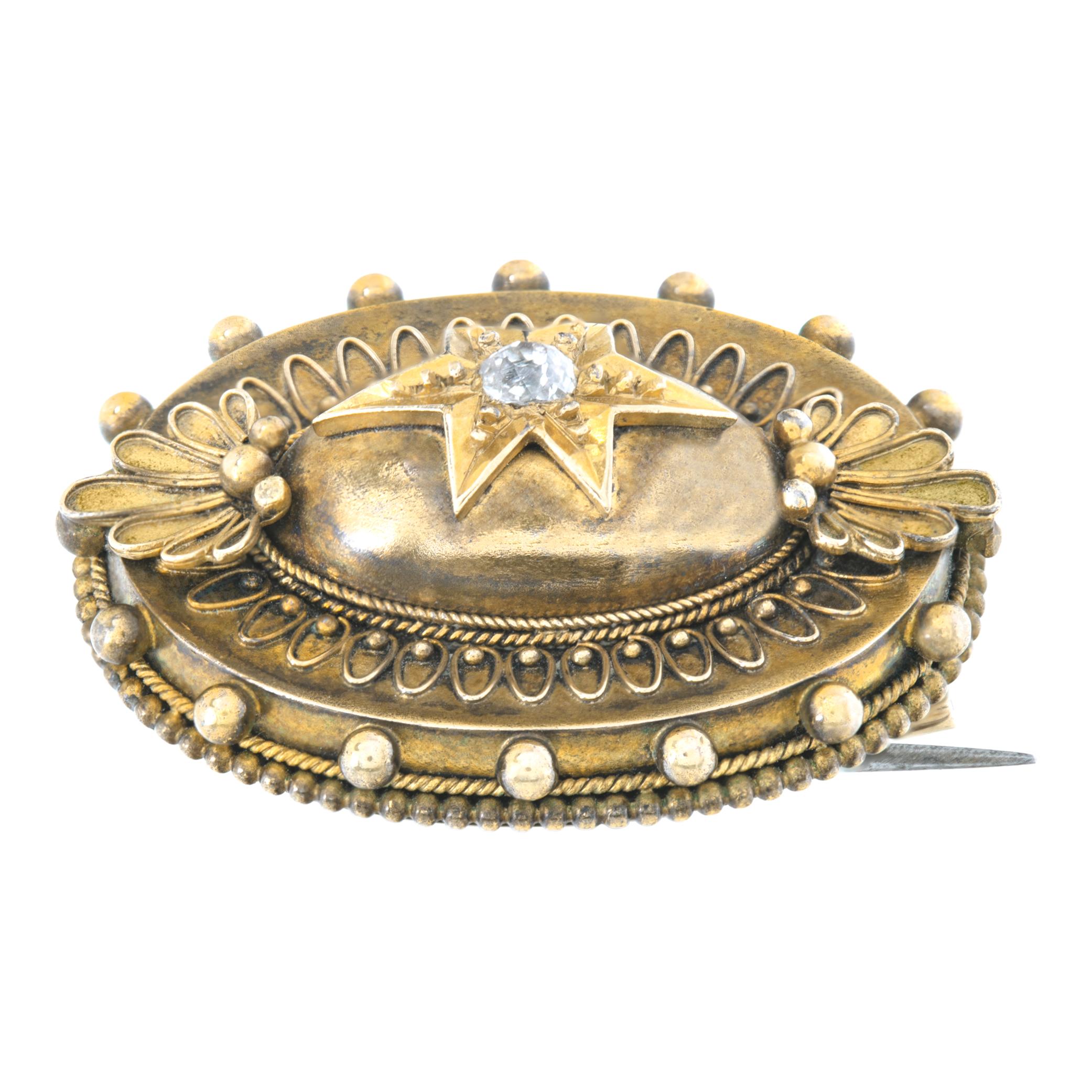 Etruscan revival brooch, circa 1990,  Victorian era Antique brooch in 18K (top tested) yellow gold. Center round brilliant cut diamond approx. 0.10 carat. White & eye clean.  Measurements: 28mm W. x 22mm H (1 1/8 x 7/8 