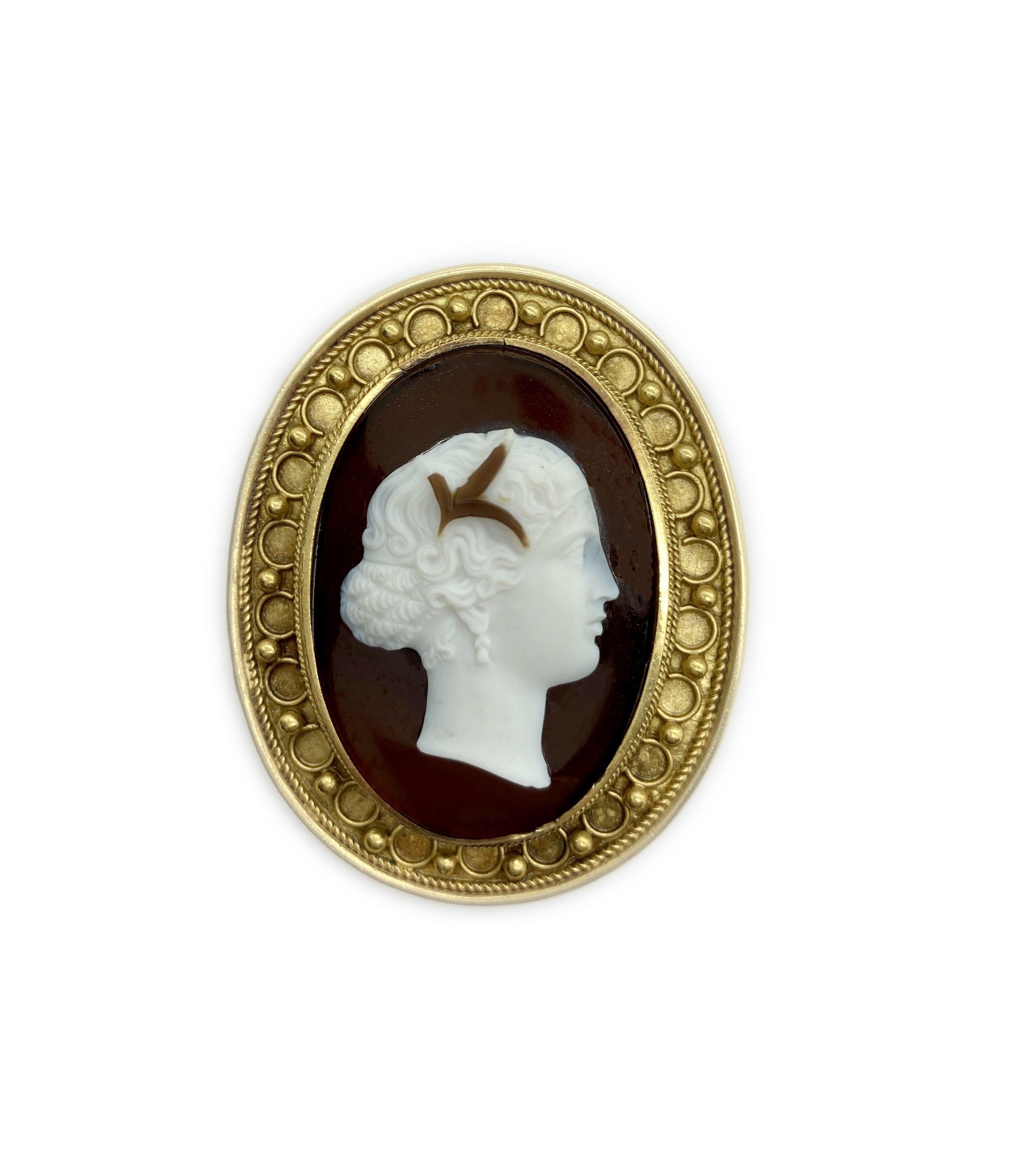 An antique agate cameo depicting the profile of a lady, encircled with gold granulation in the Etruscan archaeological revival style.
