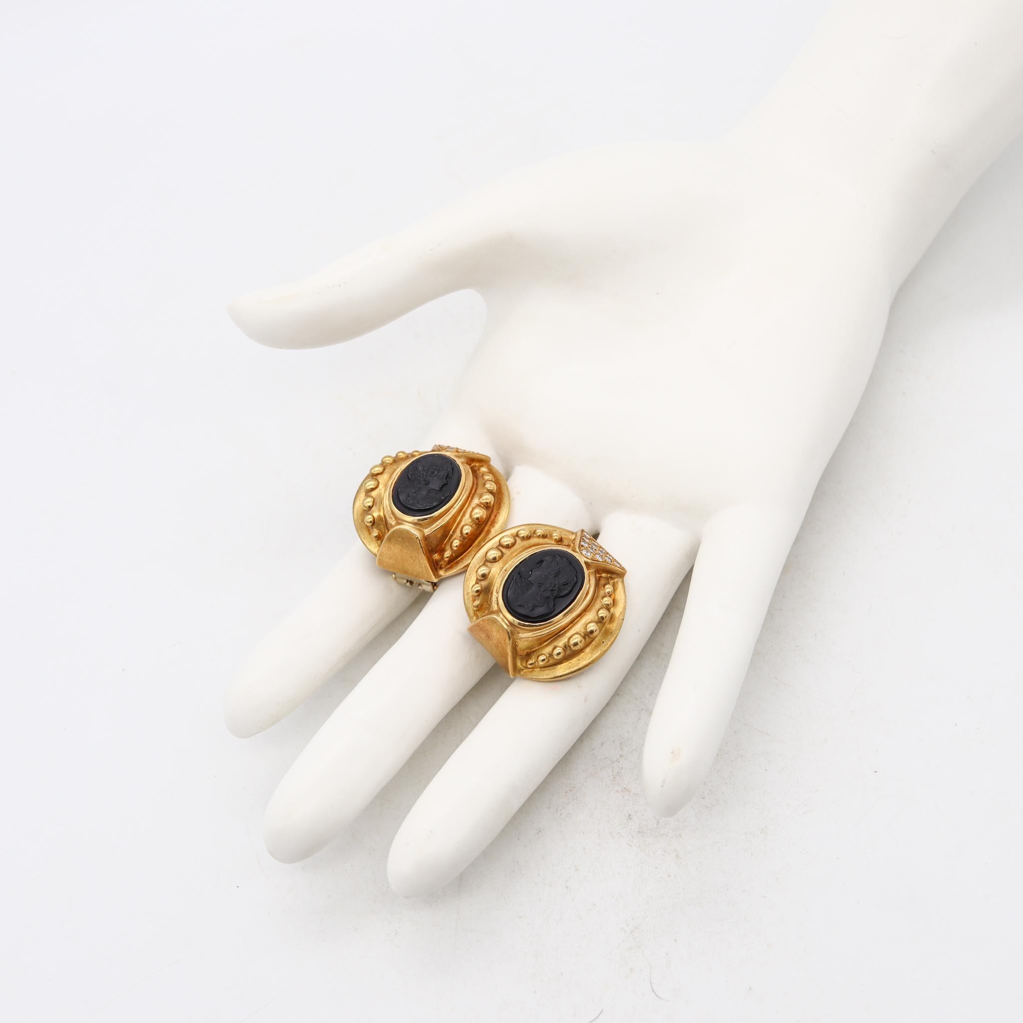 Etruscan Revival earrings.

Gorgeous, oversized and bold pair, crafted with Etruscan-Roman revival patterns in solid yellow gold of 18 karats, with satin finish. Suited with posts for pierced ears and a pair of comfortable omega backs for fastening