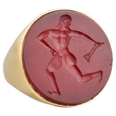 Etruscan Revival Gold Ring Set with a Carnelian Intaglio of a Running Athlete. Etruscan Revival Gold Ring Set with a Carnelian Intaglio of a Running Athlete.