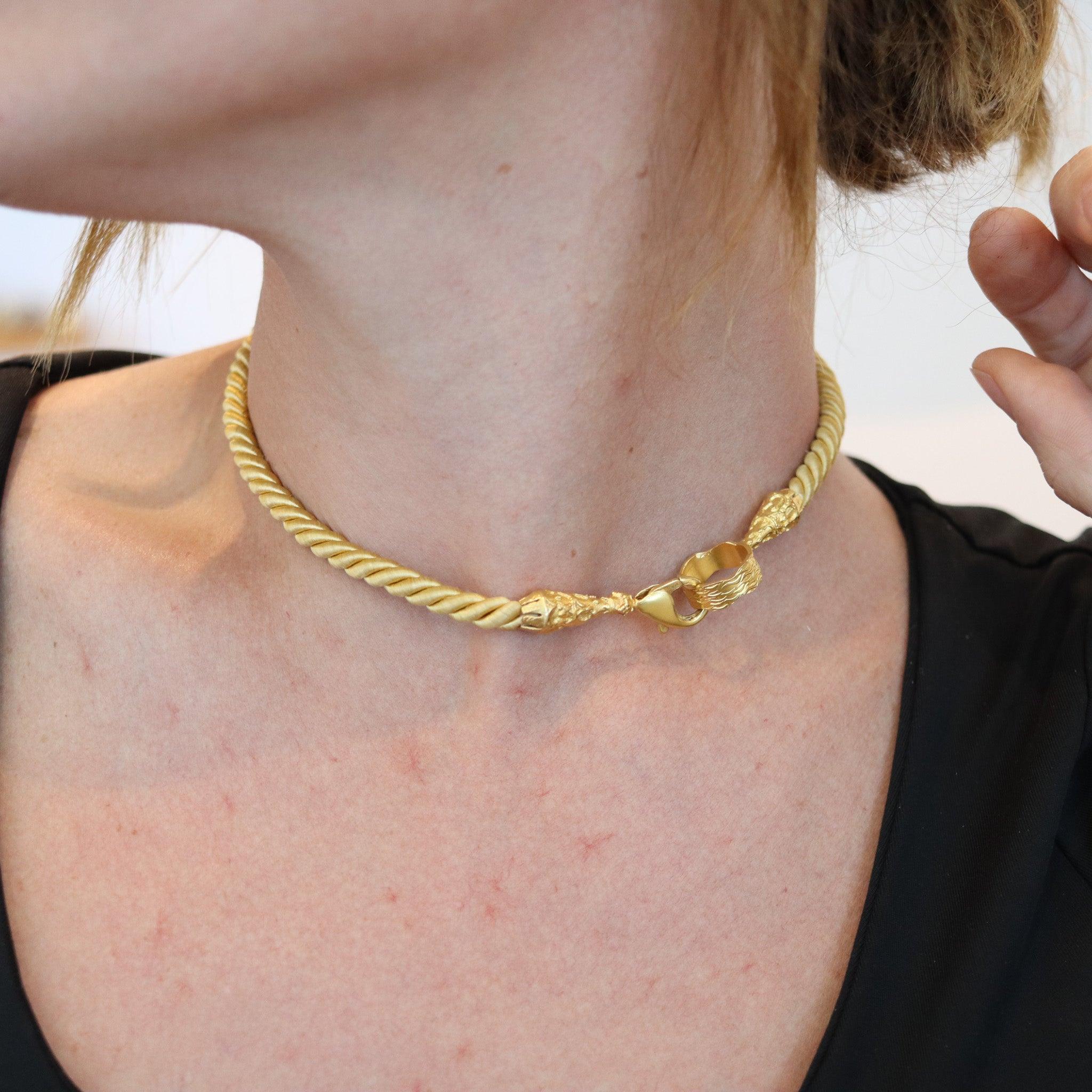 An Italian twisted silk cord necklace in yellow gold.

This is a contemporary necklace, created in Italy with parts made up in solid yellow gold of 14 karats and golden silk. The necklace is very useful and will fit to wear any piece. It was