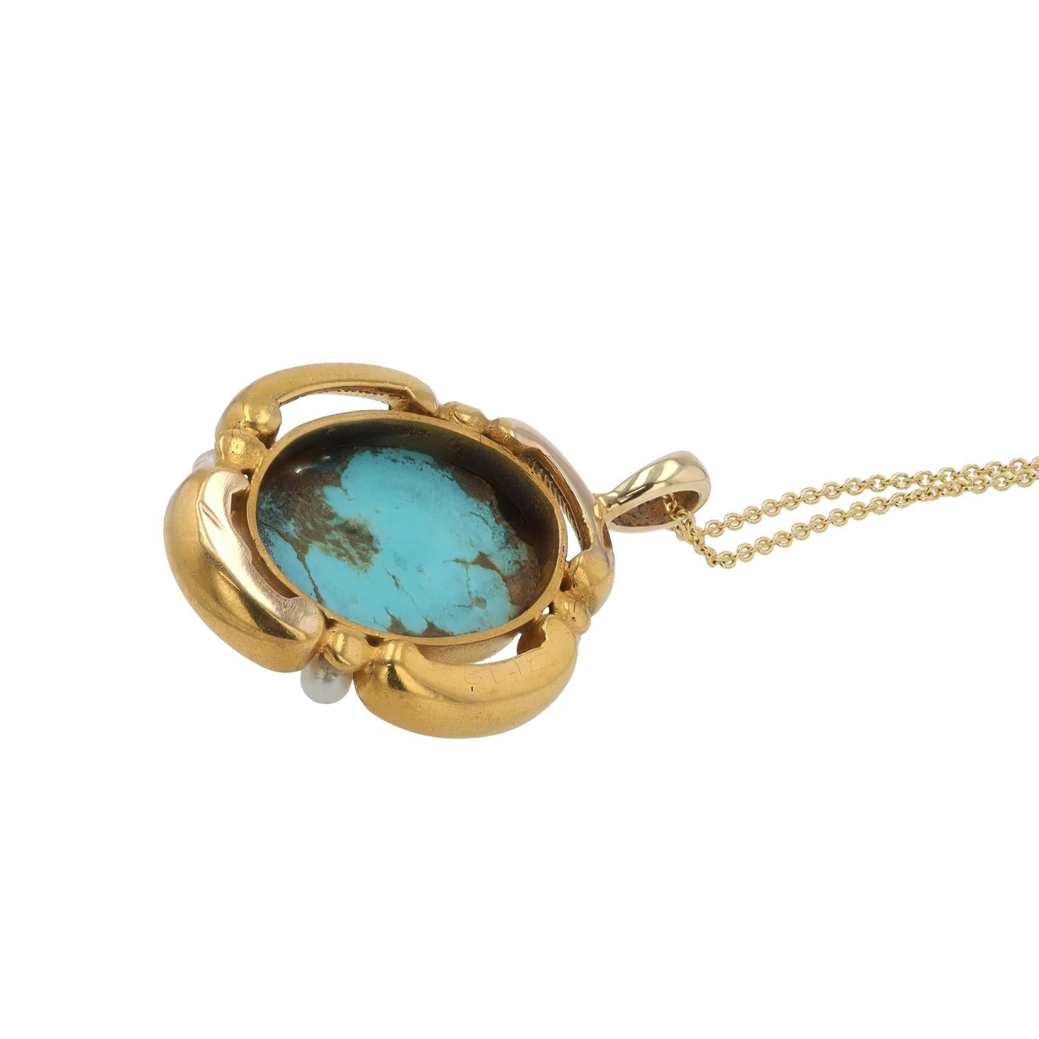 A captivating robin's egg blue turquoise highlights this antique Etruscan revival pendant necklace. Held within an engraved quatrefoil motif punctuated by lustrous seed pearls. Victorian period-correct original patina of 22k gold wash over 18k rose