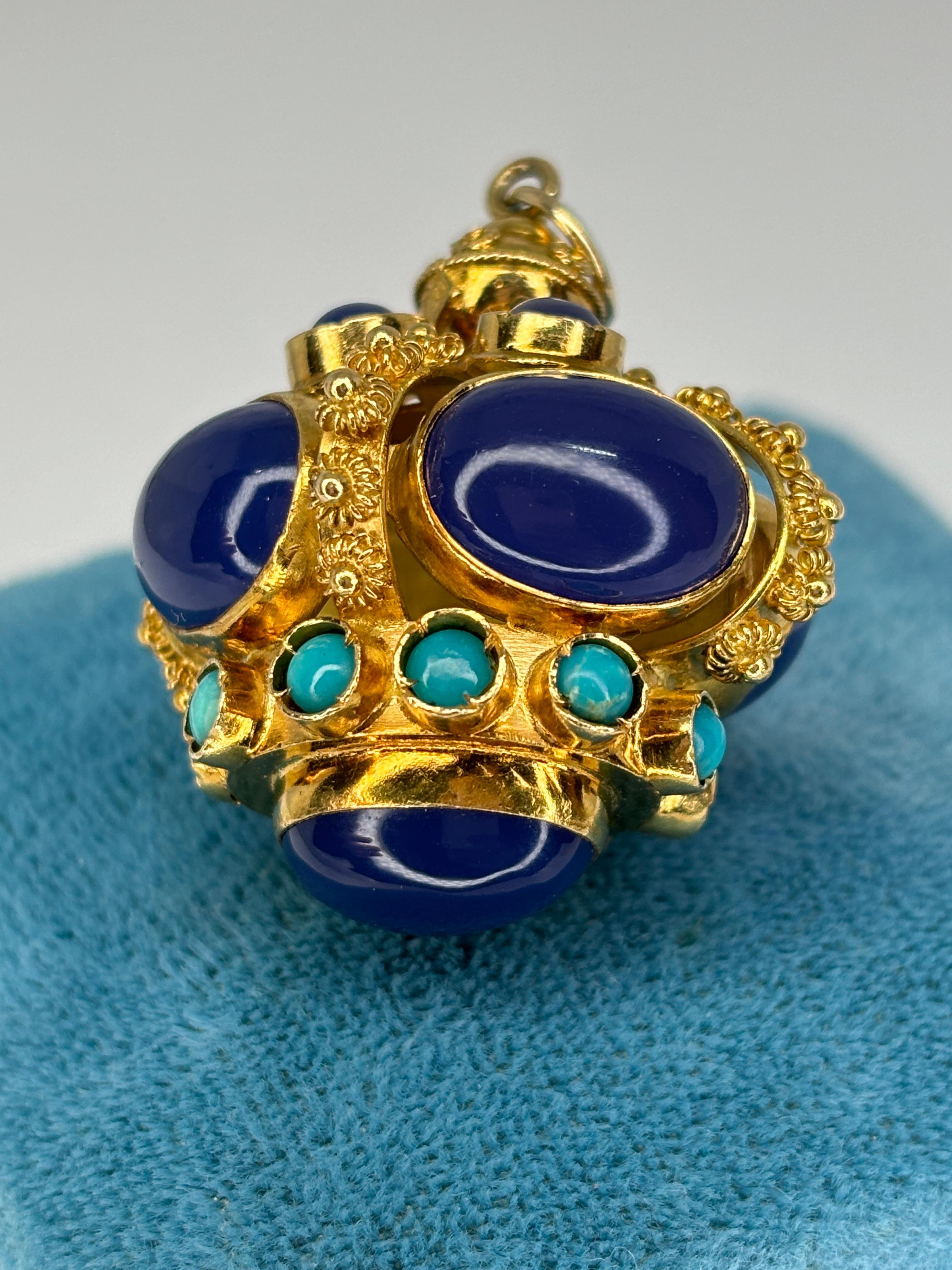 This unique watch fob is a truly exquisite piece of jewelry that combines the historical influences of the Etruscan Revival movement with the elegance of precious gemstones. This style is inspired by the craftsmanship and artistry of the ancient