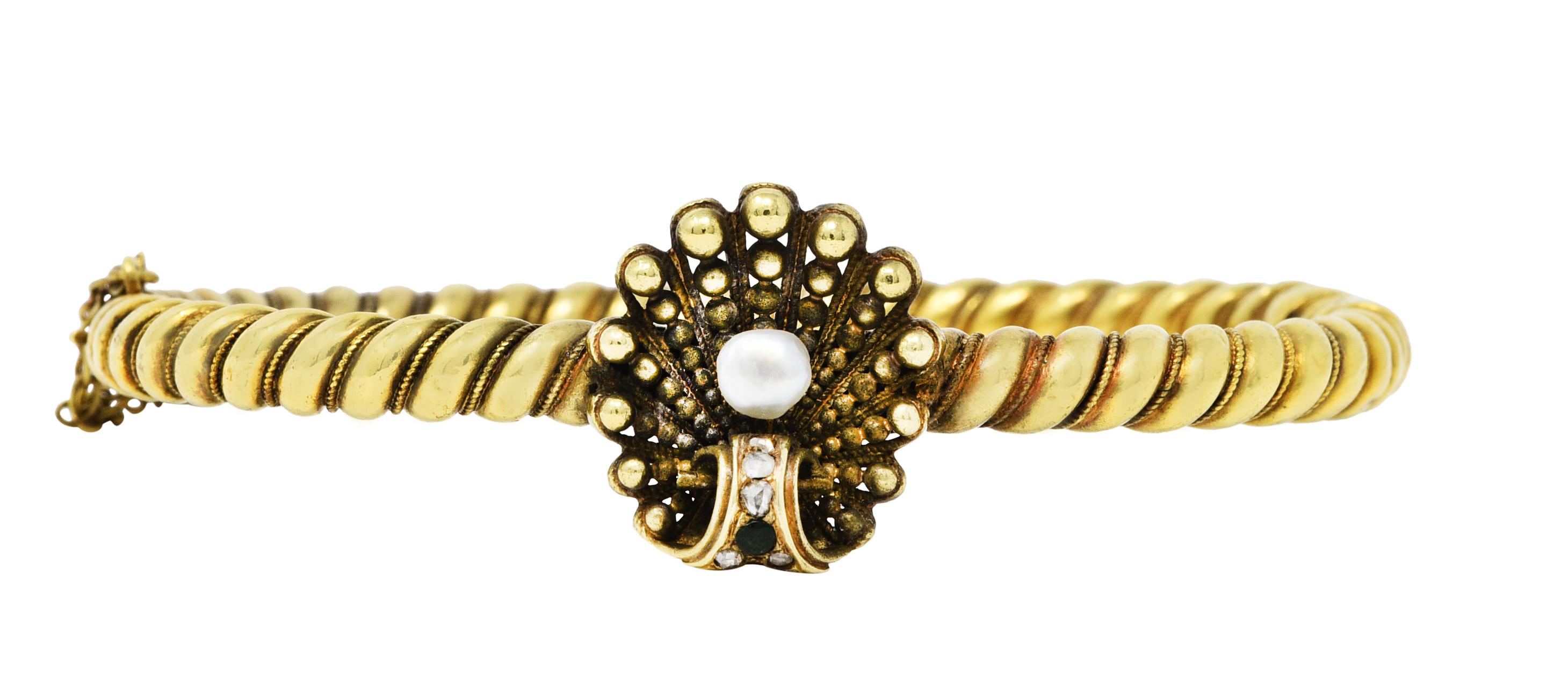 Hinged bangle bracelet is comprised of a twisted rope motif with milgrain detailing

Featuring a scrolled shell station with graduated gold beading

While centering a 4.0 mm baroque pearl - white in body color with excellent luster

With a medium