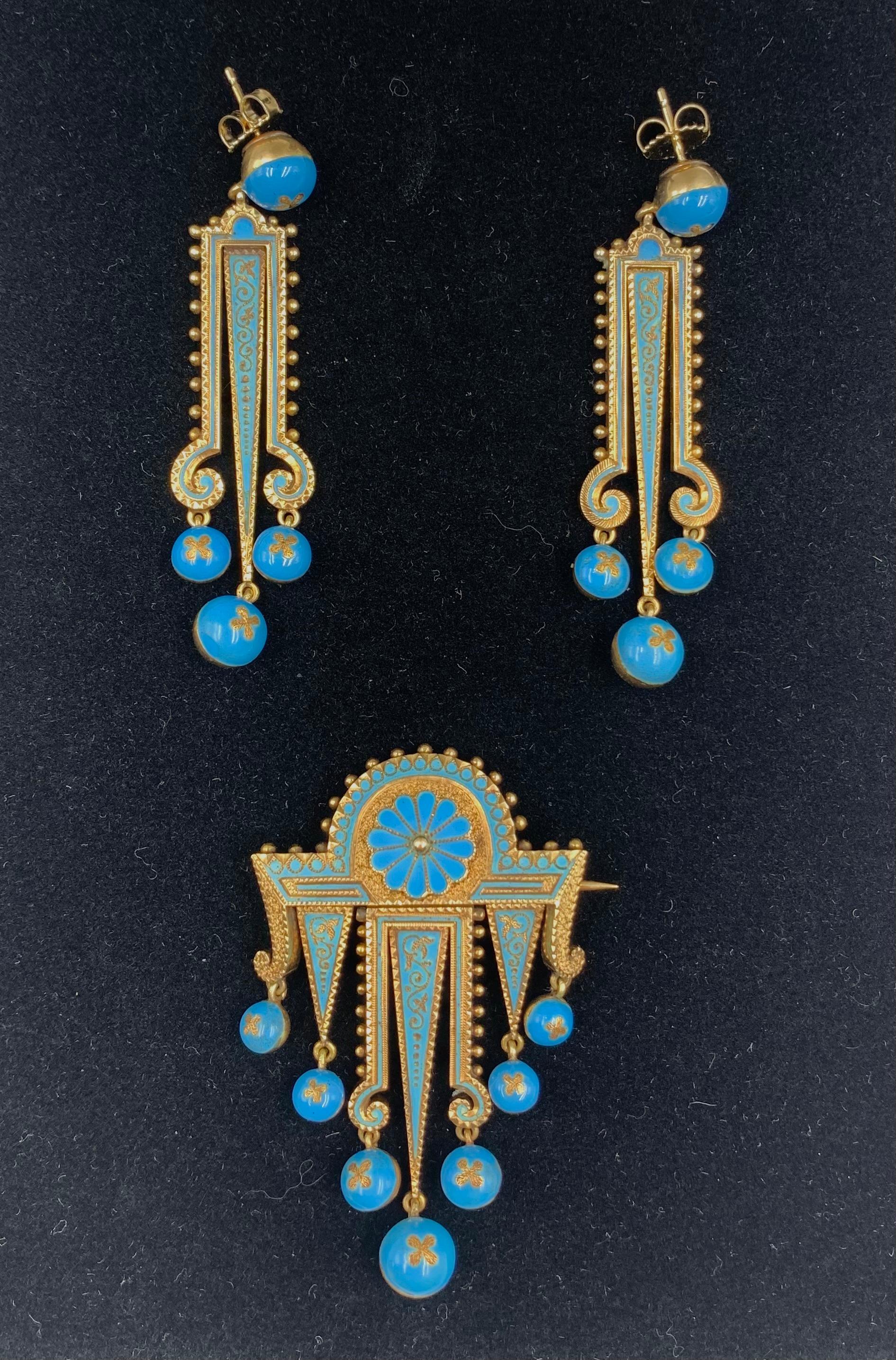 Exquisite museum quality 19th century Etruscan Revival turquoise enamel and articulated 14K yellow gold pair of earrings and brooch parure
Circa 1870
Beautiful design, large scale striking turquoise enamel suite of Archaeological Revival jewelry-