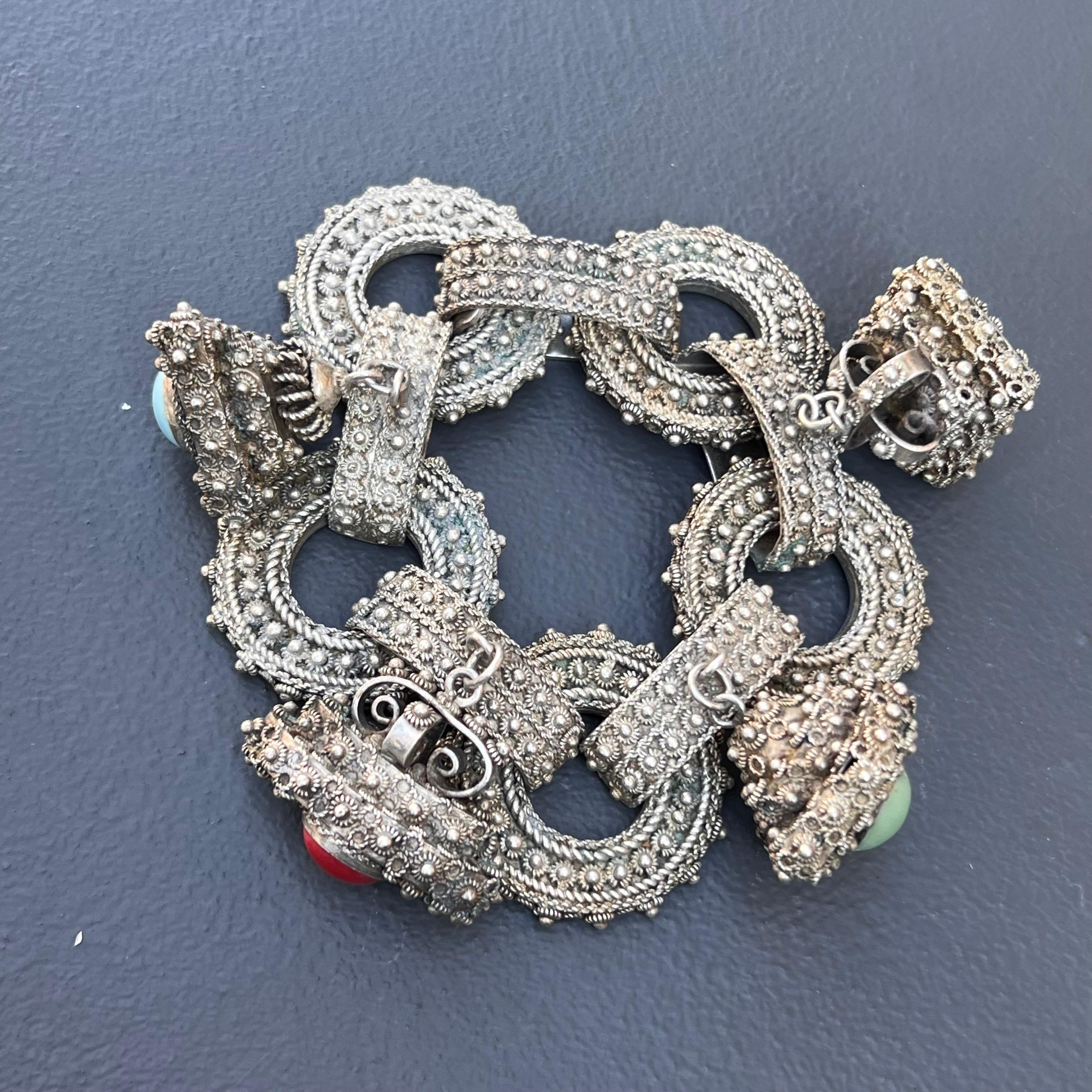 Exquisite Vintage Signed  Papa George Lebanon silver fob /charm bracelet with a wide linked chain with 4 fobs /charm with fine Etruscan style applied wire and bead work .One of the fob opens to reveal an hidden chamber. Fobs have polished cabochons