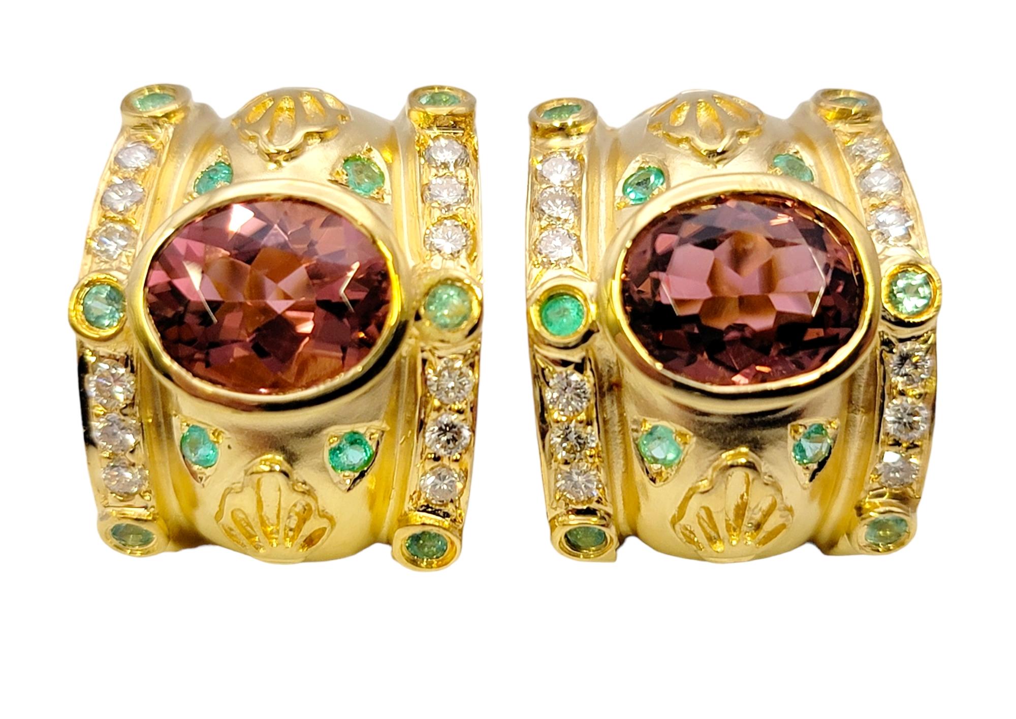 Gorgeous Etruscan style half-hoop earrings featuring vibrant tourmaline gemstones and diamonds. These stunning, ornate earrings are bursting with bold color and design. The incredible pink, green and white stones paired with the rich yellow gold
