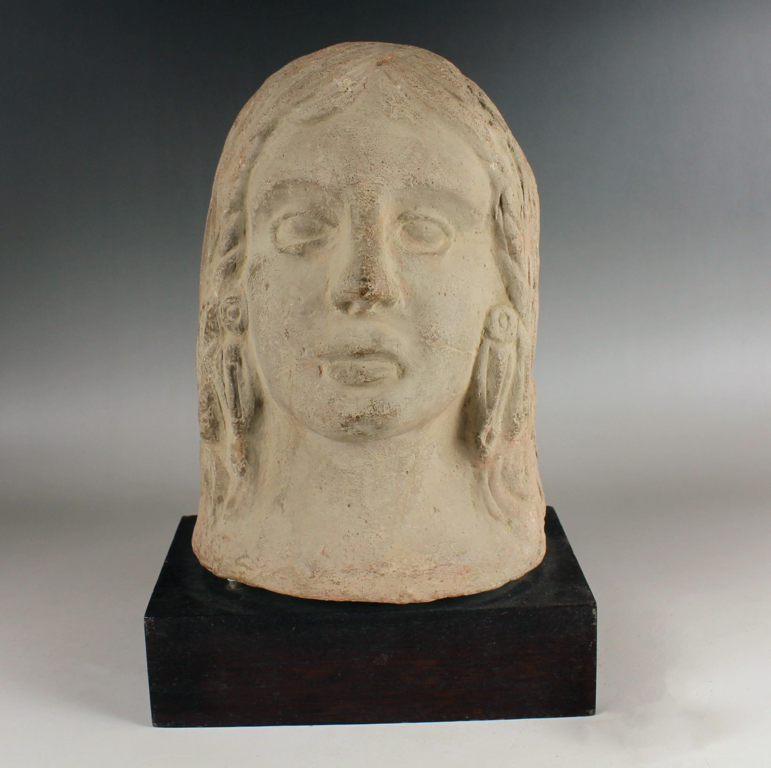 ITEM: Votive head
MATERIAL: Terracotta
CULTURE: Etruscan
PERIOD: 5th – 4th Century B.C
DIMENSIONS: 215 mm x 155 mm x 120 mm (without stand)
CONDITION: Good condition. Includes stand
PROVENANCE: Ex French private collection, E., acquired in Carrefour