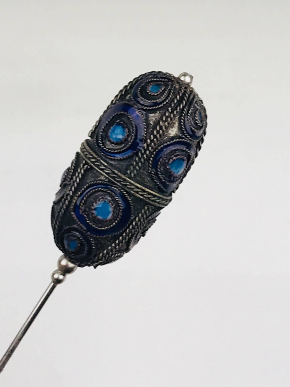 Etrusion revival, Enamel Sterling Hat Pin, Enamel with handmade roped edging.
Finely made with different colored blue enameling
1-1/3 inch long enamel top x 3/4 inch wide
Circa 1870

GIA Gemologist inspected and evaluated