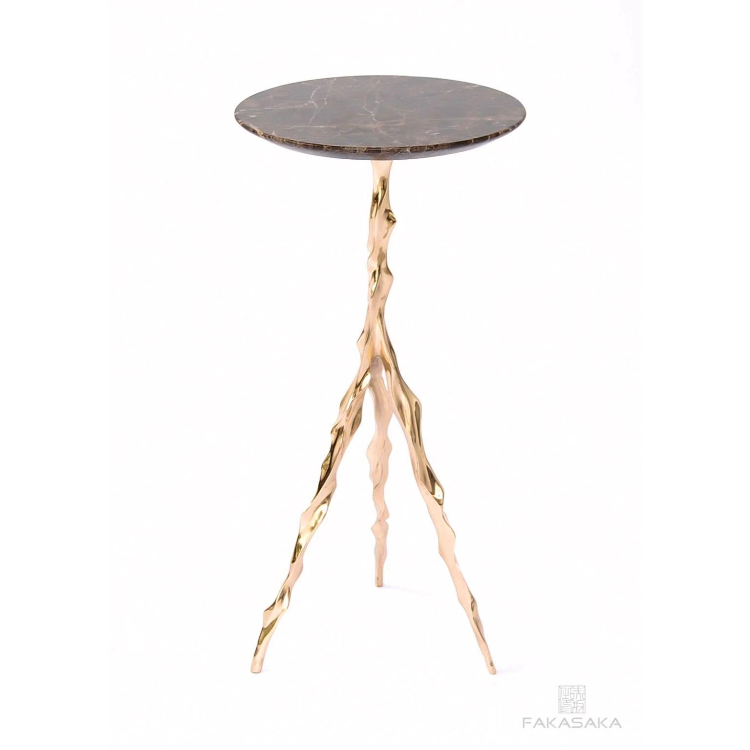 Etta drink table with Marrom Imperial marble top by Fakasaka Design.
Dimensions: W 27 cm, D 27 cm, H 62 cm.
Materials: polished bronze base, Marrom Imperial marble top.
 
Also available in different table top materials:
Nero Marquina Marble