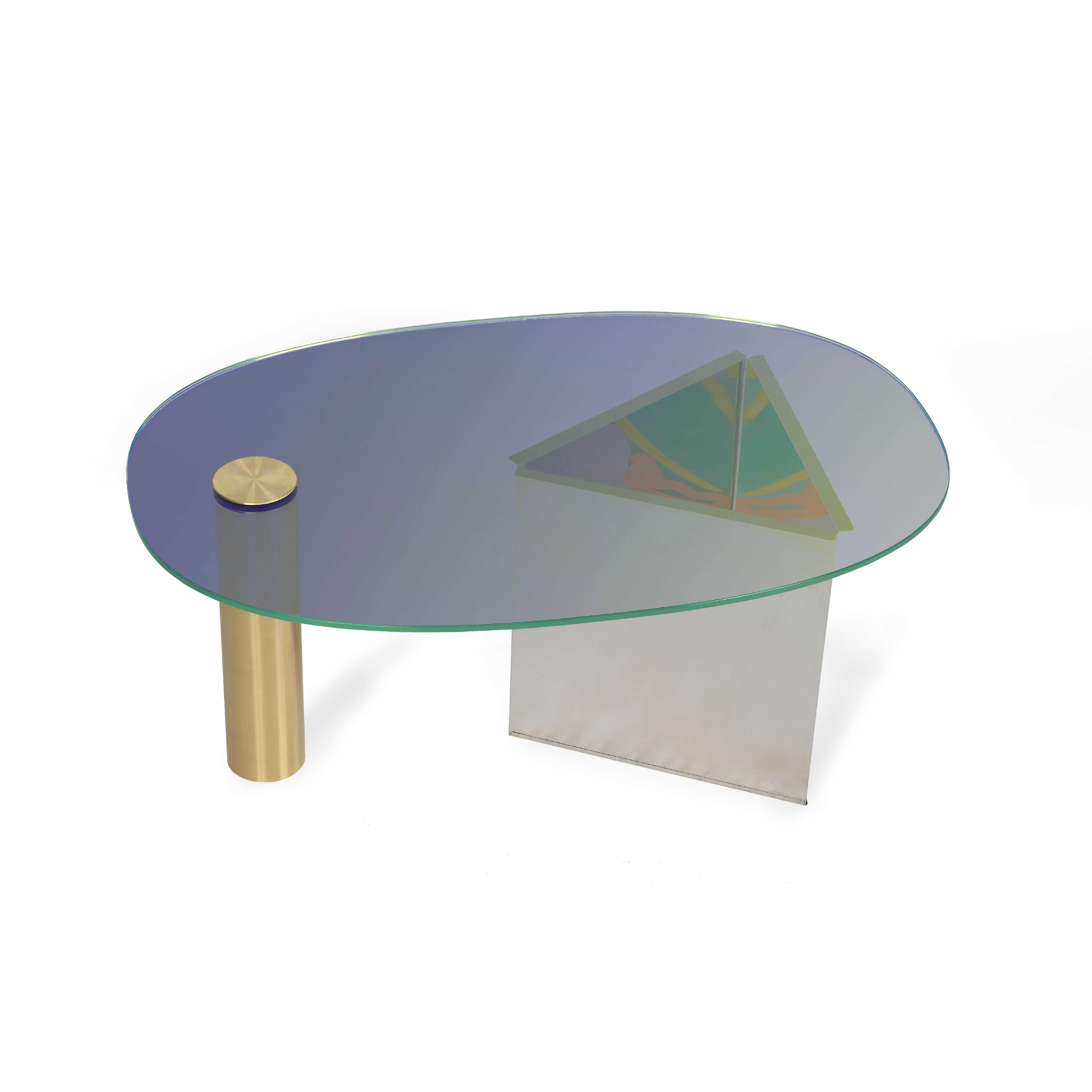 Ettore Blue Coffee Table by Asa Jungnelius
Dimensions: 43 x 67 x 100 cm
Materials: Dichroic glass, brass and stainless steel.

Each table is individually painted by the artist. Limited edition

Asa Jungnelius is a visual artist (MFA) and a