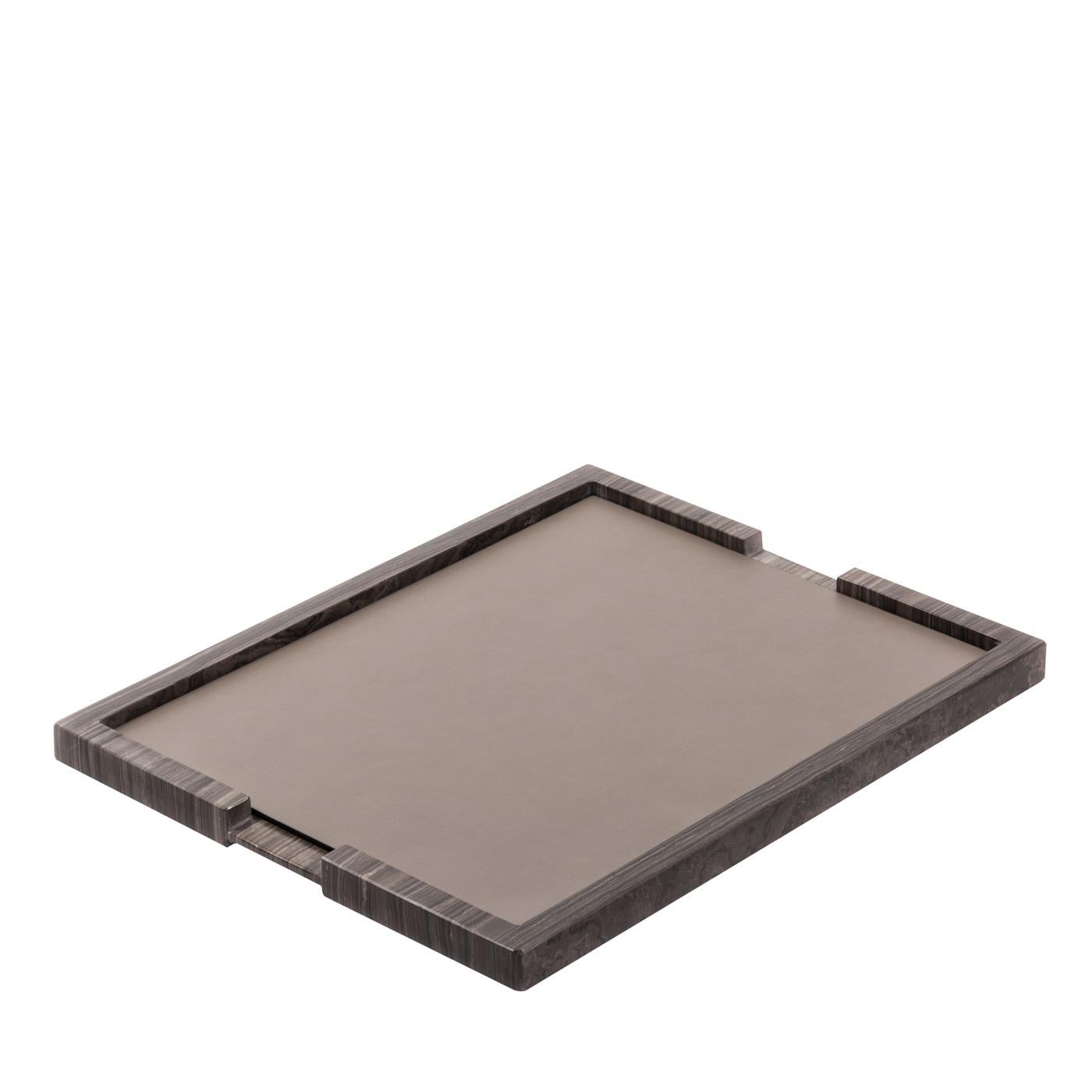 This Minimalist silhouette of this tray, combined with the traditional flair of its materials, makes it a striking addition to a modern interior that can be displayed and used anywhere in the house. A display surface for collectibles or a versatile