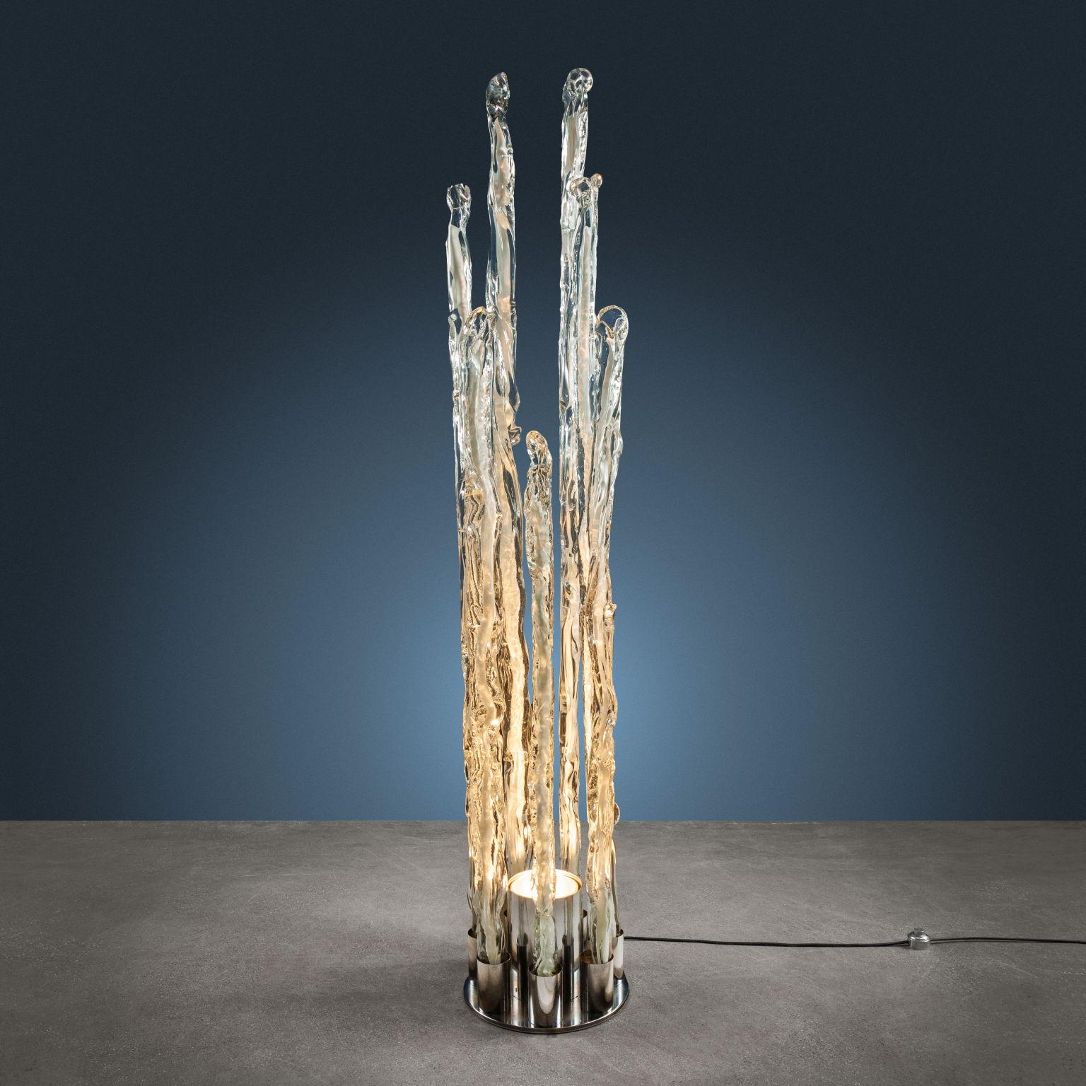 Floor lamp in transparent Murano glass with inclusions of glass paste and base in chromed metal. 'Excalibur' series, designed by Ettore Fantasia and Gino Poli for a Sothis production.