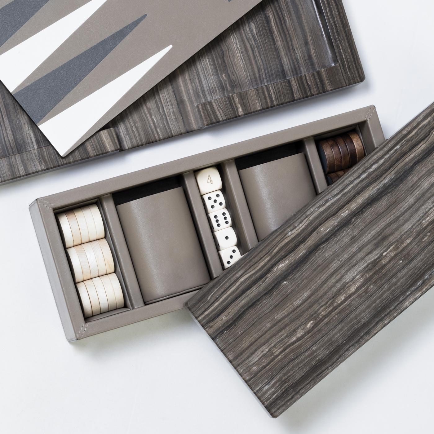 Part of the Ettore collection, this elegant backgammon board is so striking that can be displayed on a living room coffee table, console, or side table as a superb decorative object. The rectangular Silhouette in Eramosa brown marble features inlays