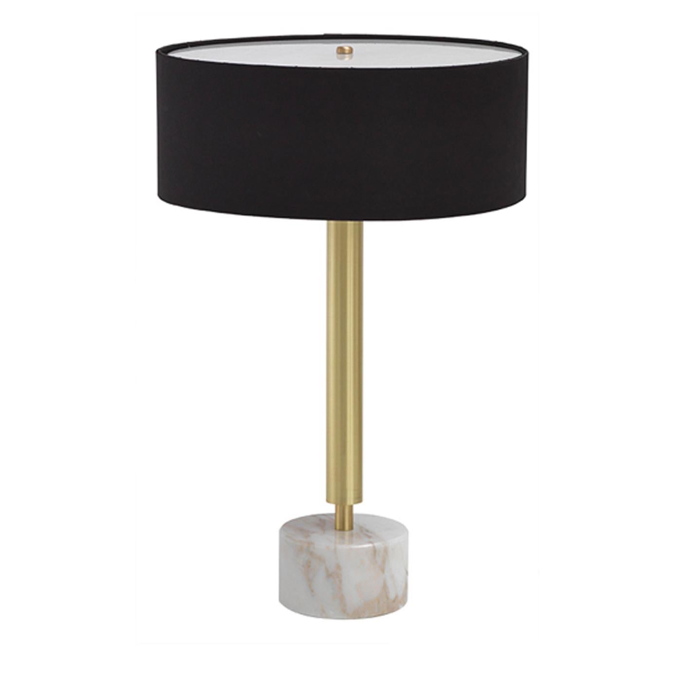 The Ettore round table lamp is pure luxury, setting the tone in a contemporary hotel lounge or private living room. On a rounded Calcatta gold marble base, the lamp features a brass stem with a satin finish and a round shade to complement the base.