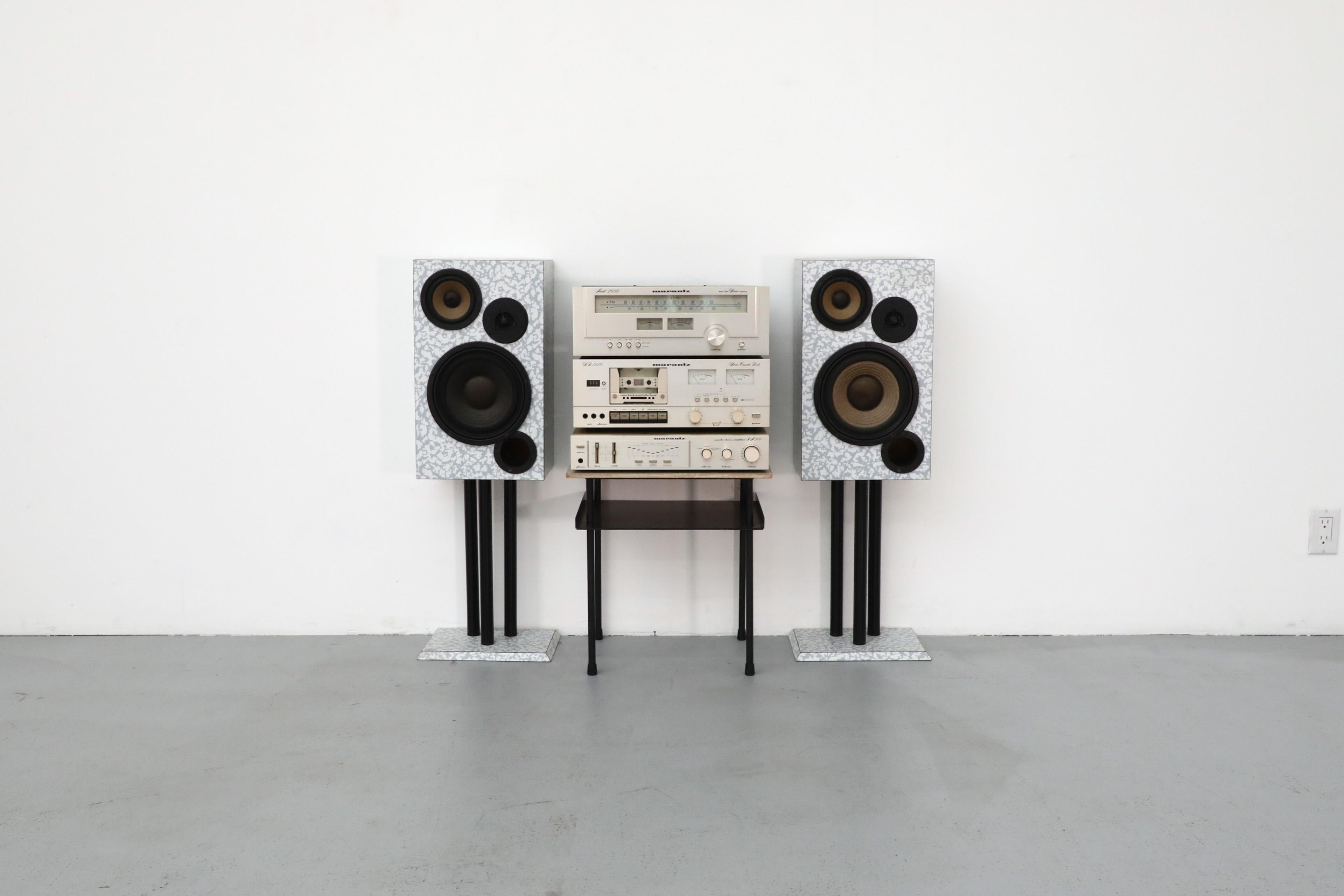 Set of audio equipment from manufacturer Marantz including Memphis style speakers attributed to Italian designer Ettore Sottsass. Components in champagne metal. Buyer to verify full functionality of all components. Turns on. Included: Marantz SD1010