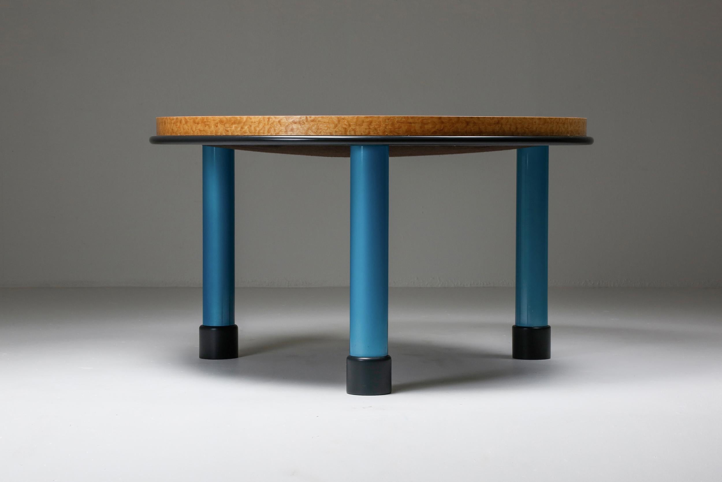 Ettore Sottsass; table; side table; Italian design; Memphis design; 
Table with burl wood top and blue lacquer leggs. 

Ettore Sottsass (14 September 1917 – 31 December 2007) was an Italian architect and designer during the 20th century. His body of