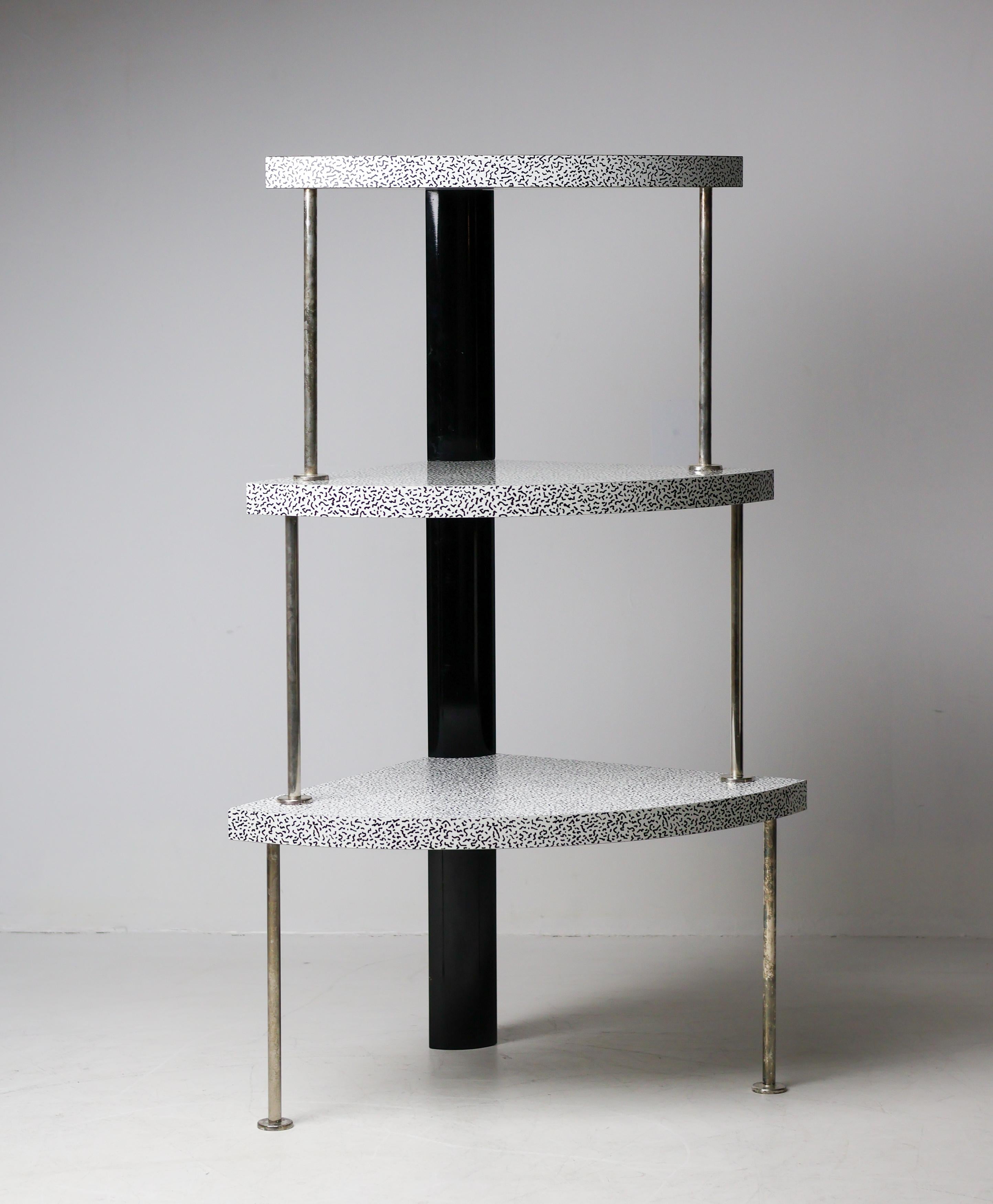 Striking “Cantone” corner cabinet designed by Ettore Sottsass, an iconic example of the Italian postmodern master’s sculptural and architectural approach to furniture. This piece embodies Sottsass’ signature playfulness with geometric form, color,