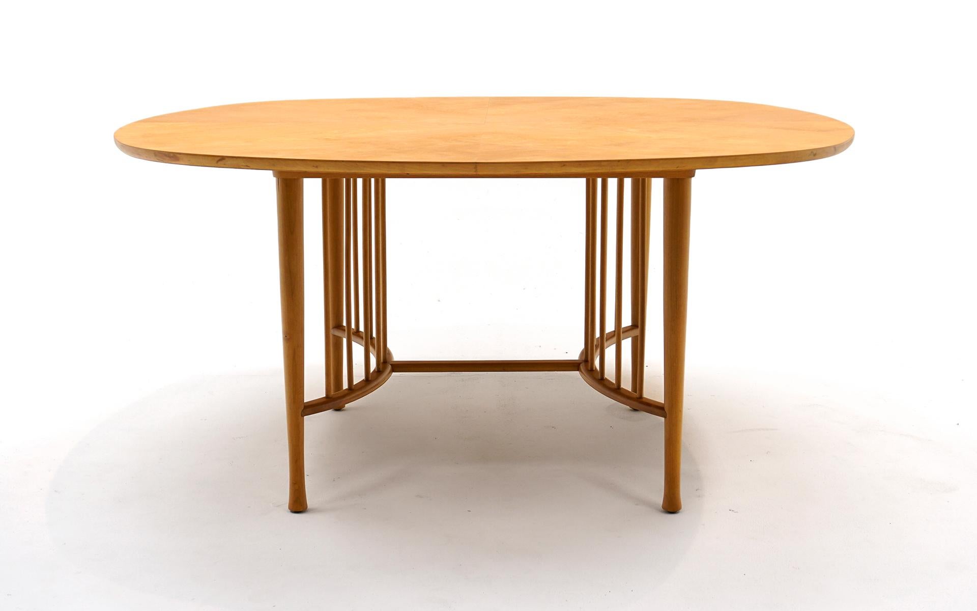 Beautiful dining table in the style of Ettore Sottsass in maple.  Expertly restored and refinished.  Unusual square form with round corners.  This table can seat up to 8 people.  