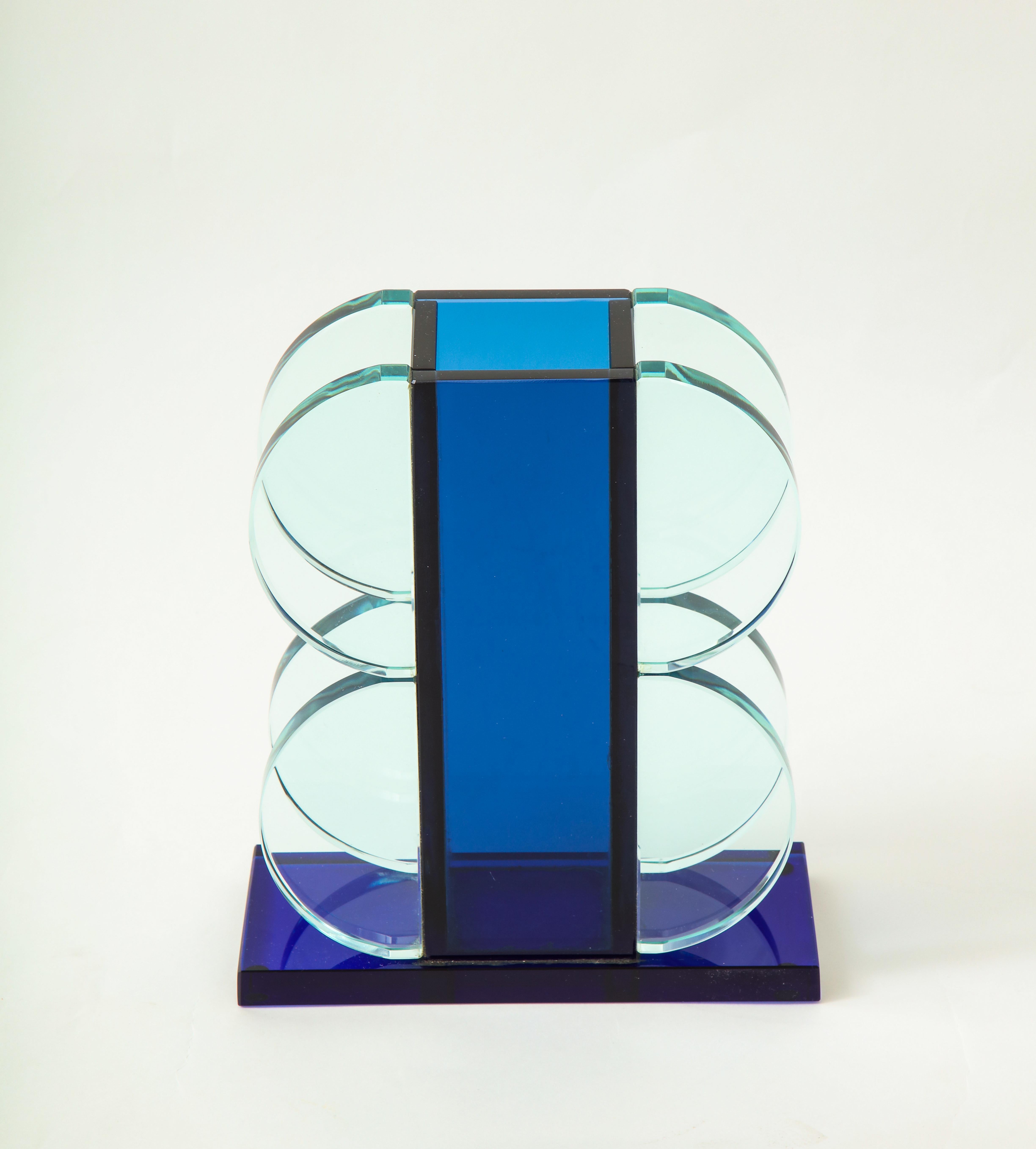 Ettore Sottsass for Fontana Arte dark blue crystal vase with light blue crystal geometric attached semi-circle shapes on rectangular dark blue crystal base.

Literature:
Design aus Italien, Krause, pg. 139 