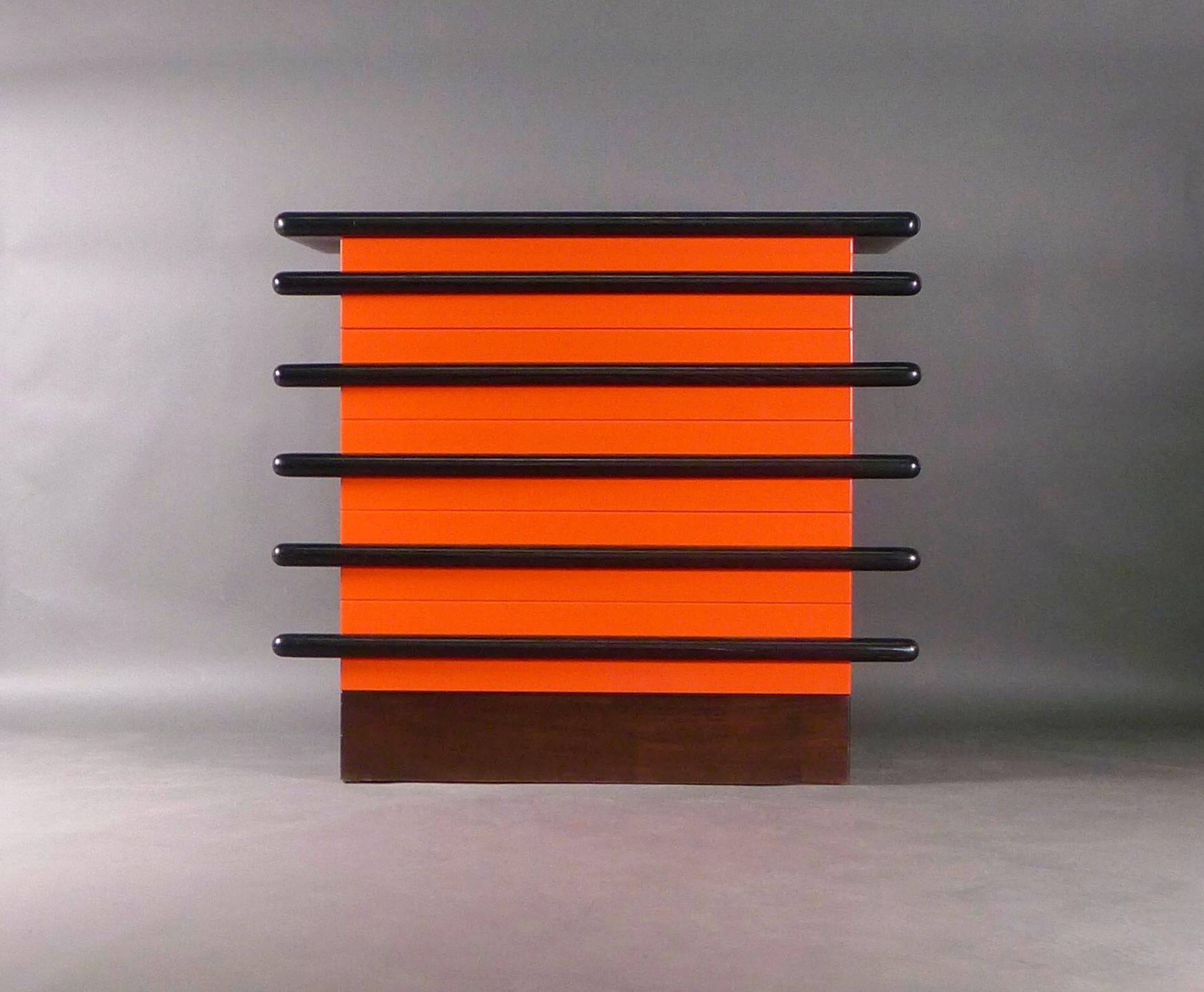 Ettore Sottsass 'Bastonio' chest of five drawers, designed 1963 and manufactured by Poltronovo, Agliana, Italy.

Constructed from Sipo and Beechwood with Indian Rosewood veneer and black and red lacquered ash.  

101cm high, 112cm wide, 60cm deep